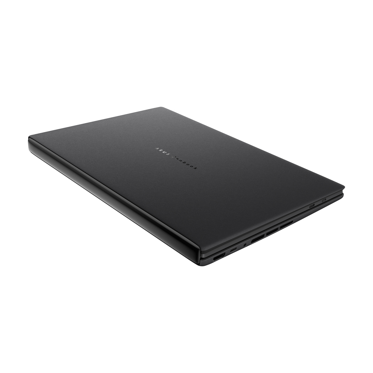 Un laptop Asus Zenbook nero chiuso con logo argento, su sfondo bianco.