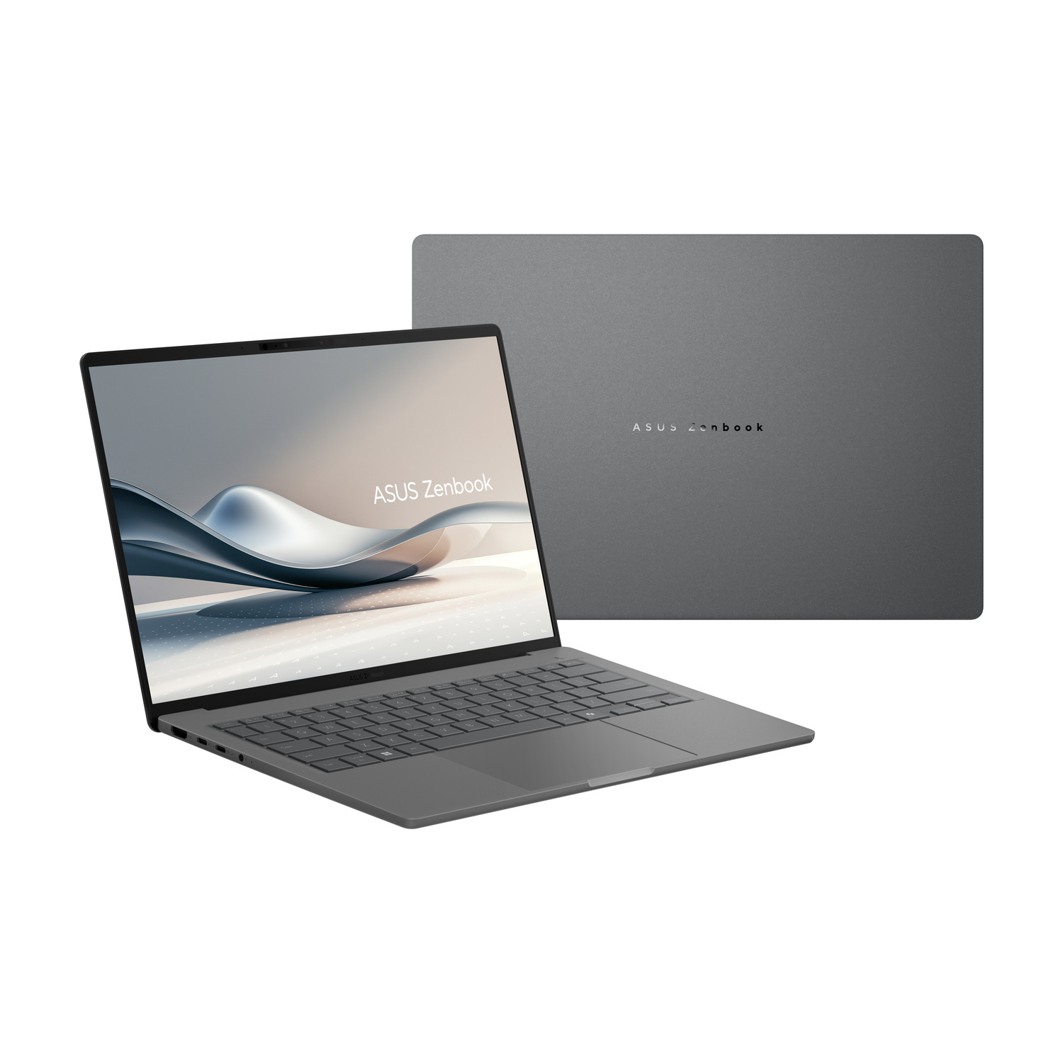 Un laptop Asus Zenbook grigio aperto che mostra tastiera e schermo.
