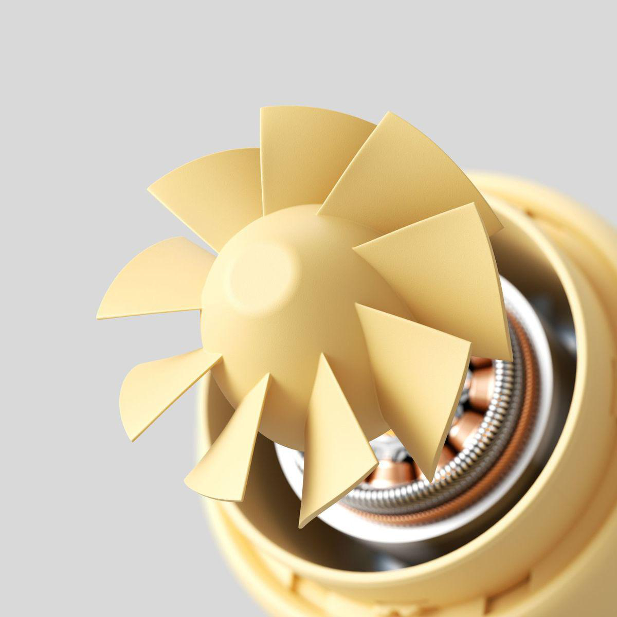 Gelber Ventilator mit sichtbarem Motor und Kupferwicklungen.