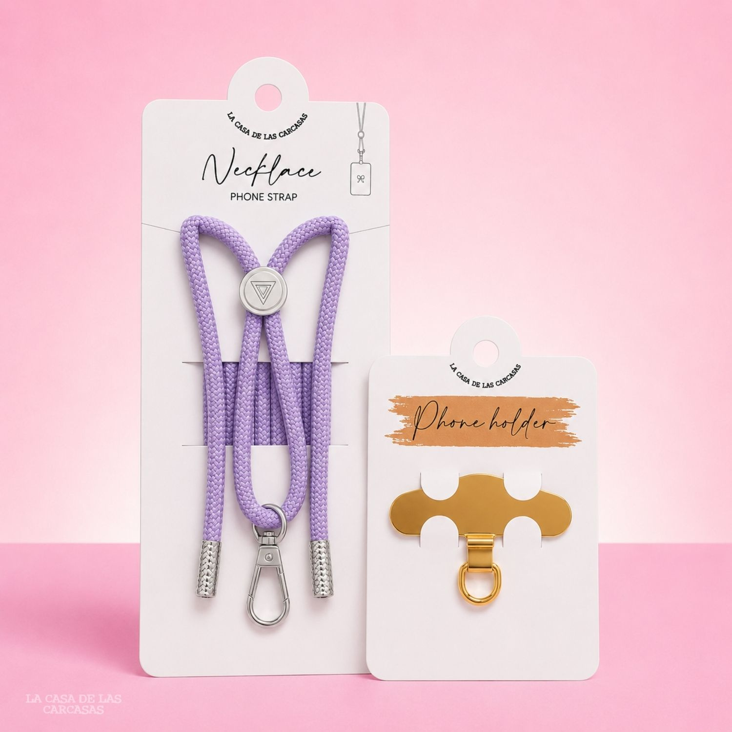 Una collana per telefono viola e un supporto per telefono dorato su confezione.