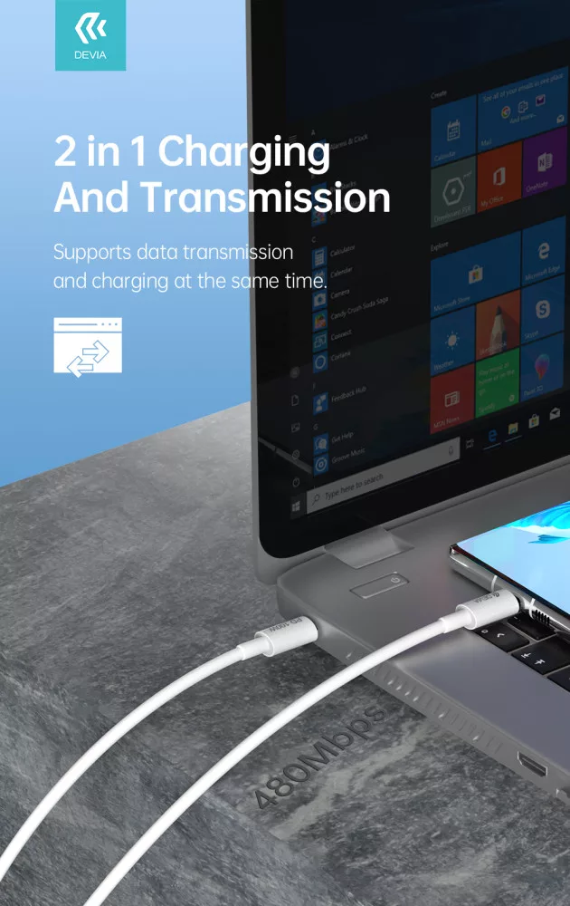 Egy laptop csatlakozik egy okostelefonhoz. Egy fehér kábel töltéshez és adatátvitelhez.