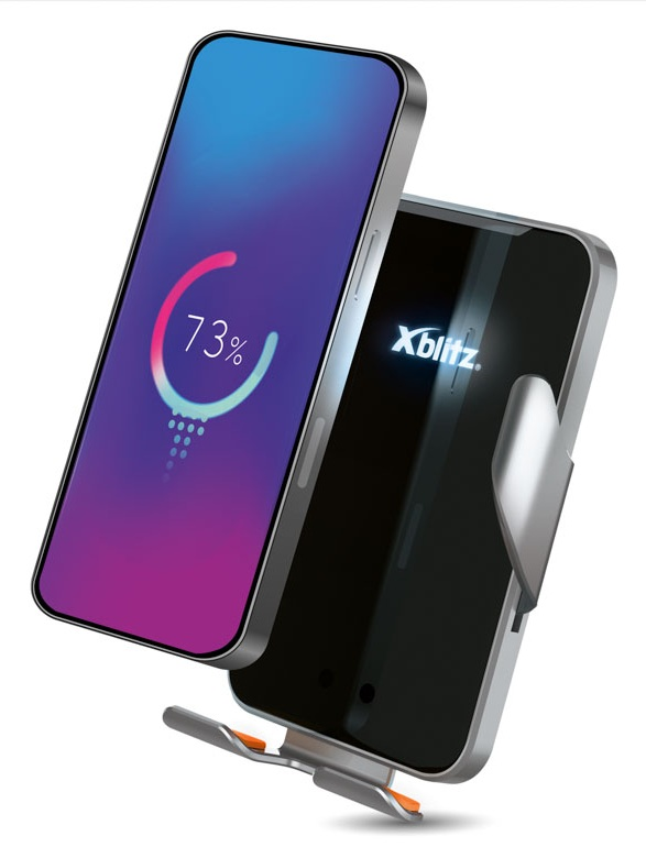 Smartfon pokazujący 73% naładowania obok czarnego uchwytu na telefon.