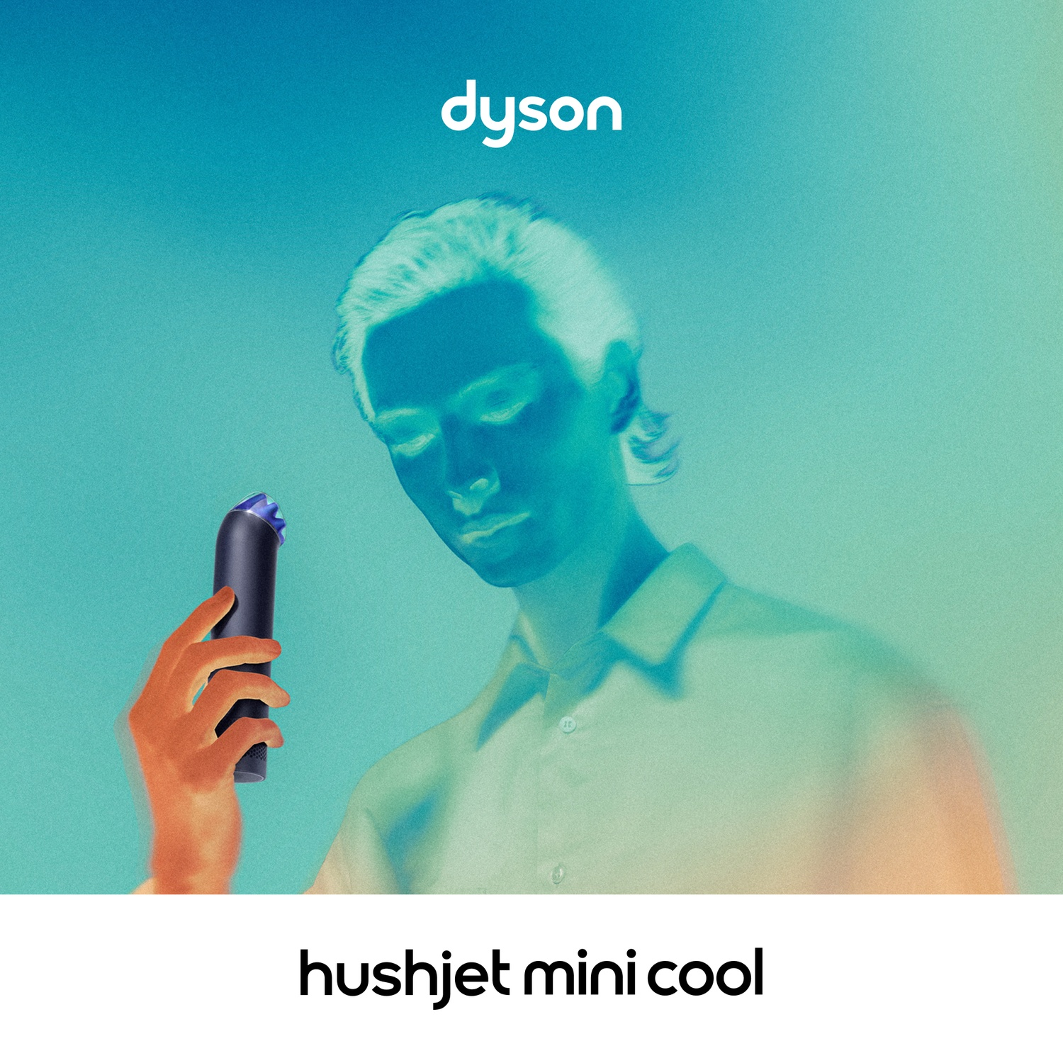 Man holding Dyson Hushjet Mini Cool against a teal background.