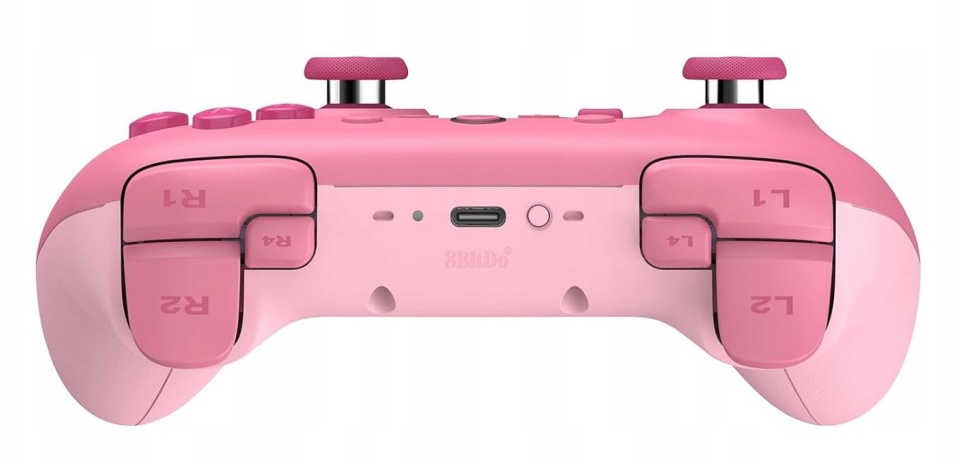 Różowy kontroler do gier ze srebrnymi i czarnymi akcentami, szczegółowymi przyciskami i portem USB-C.