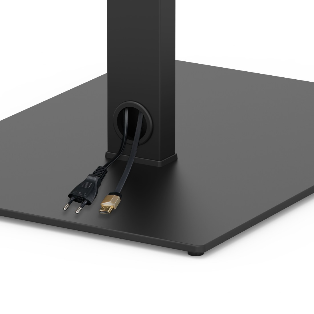 Fekete HDMI kábel és dugó jön ki egy oszlopból egy sötét alapon.