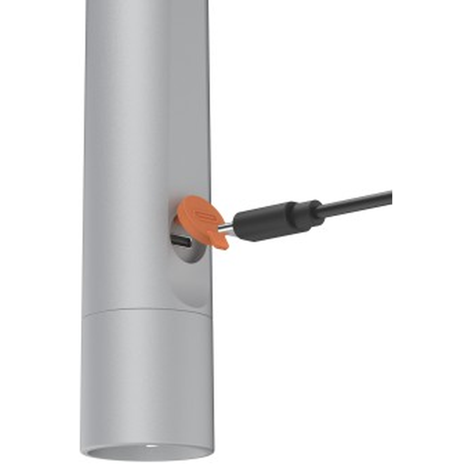 An orange plug is inserted into a silver cylindrical object.