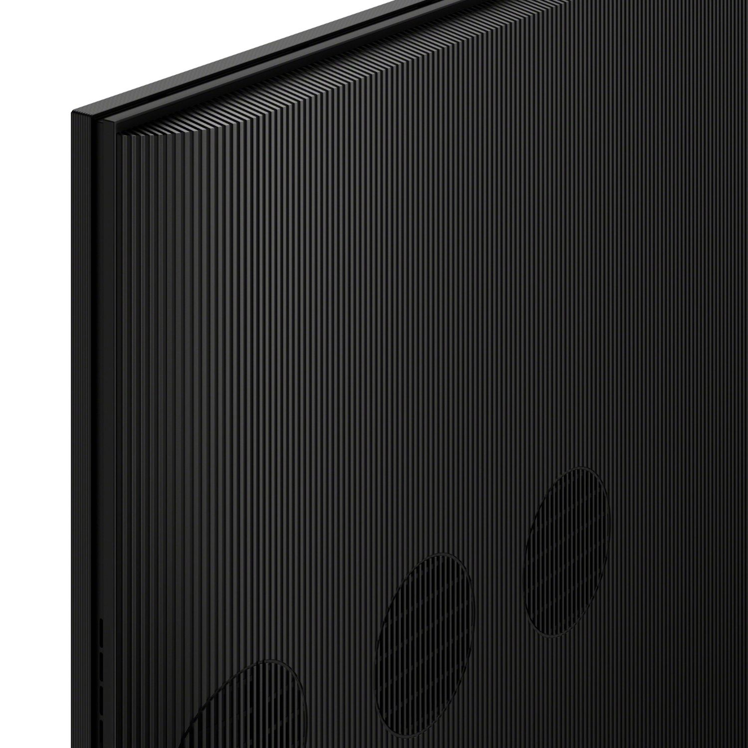 Primer plano del reverso negro de un televisor con estrías verticales y tres rejillas de altavoz ovaladas.