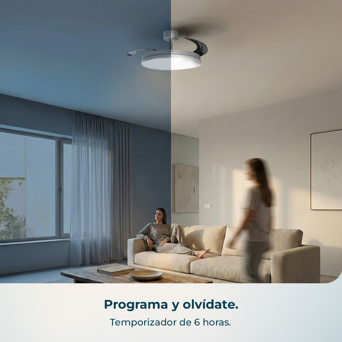 Una mujer sentada en un sofá, otra pasa. Ventilador de techo con luz.