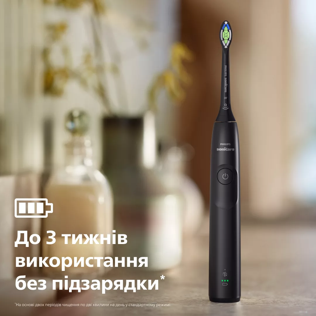 Czarna szczoteczka Philips Sonicare ze wskaźnikiem baterii i tekstem.