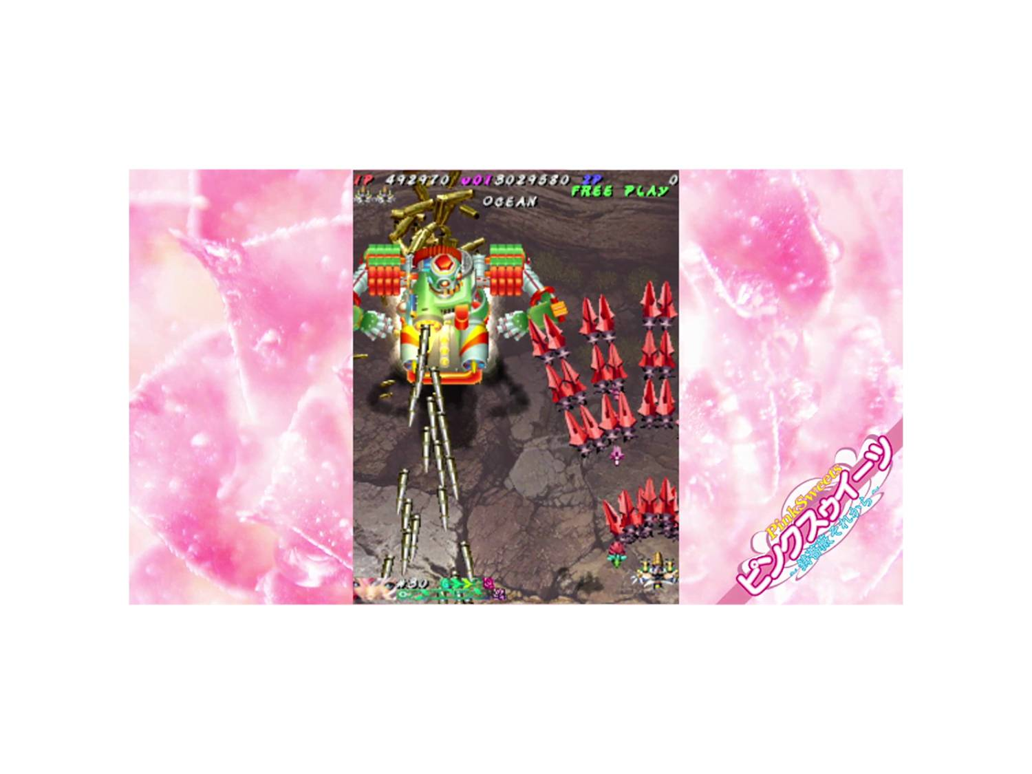 Una nave espacial verde lucha contra cohetes rojos sobre fondo rocoso con patrón rosa.