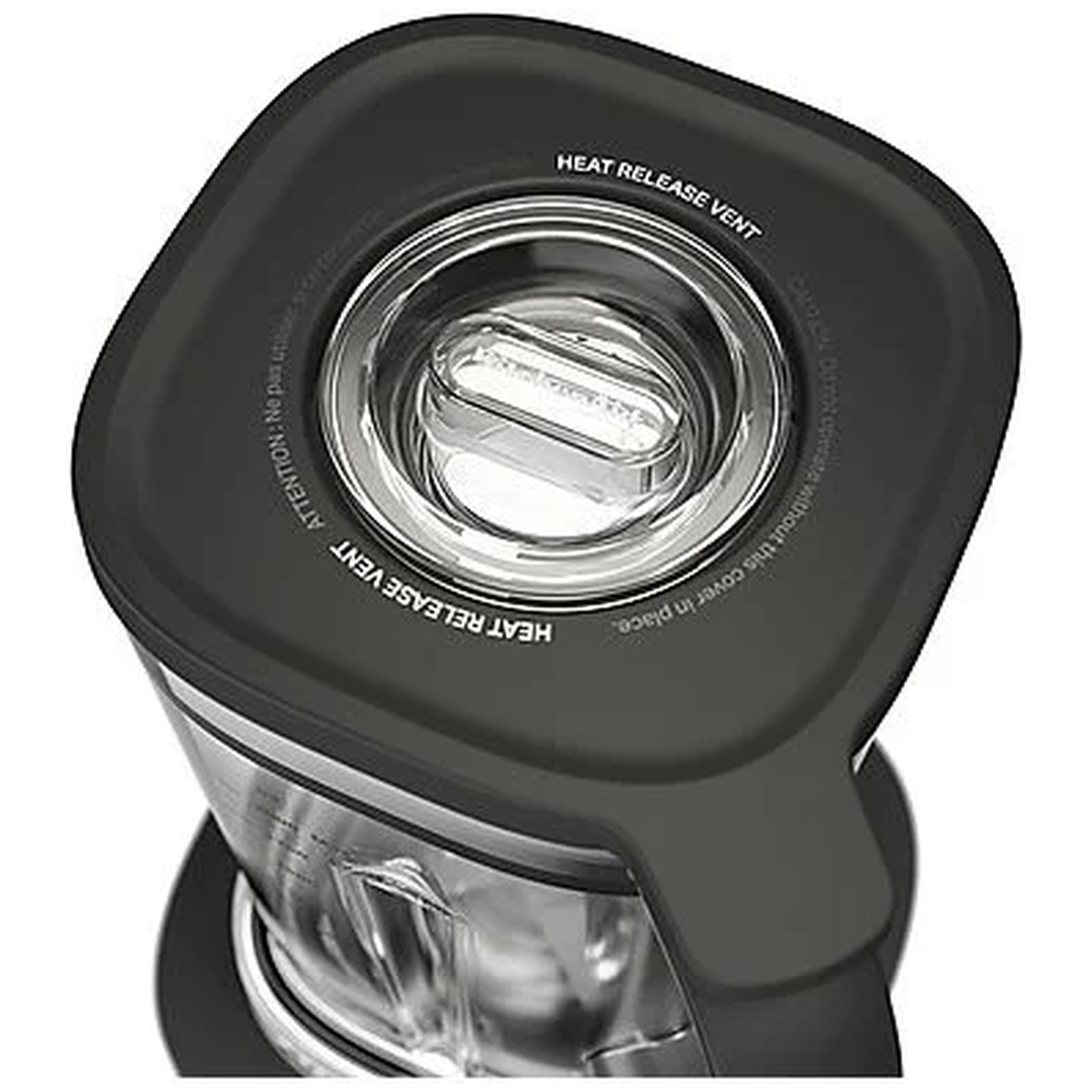 Close-up of a black blender lid with a clear heat release vent and warnings.