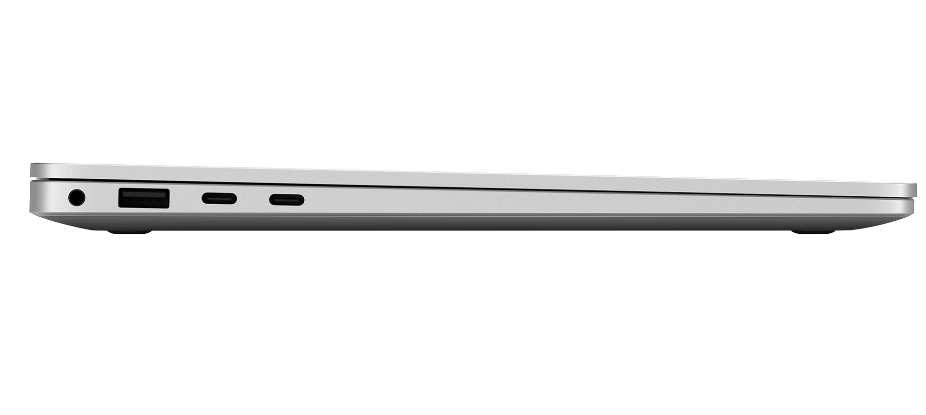 Vista lateral de un portátil plateado, mostrando un conector para auriculares, un puerto USB-A y dos puertos USB-C.