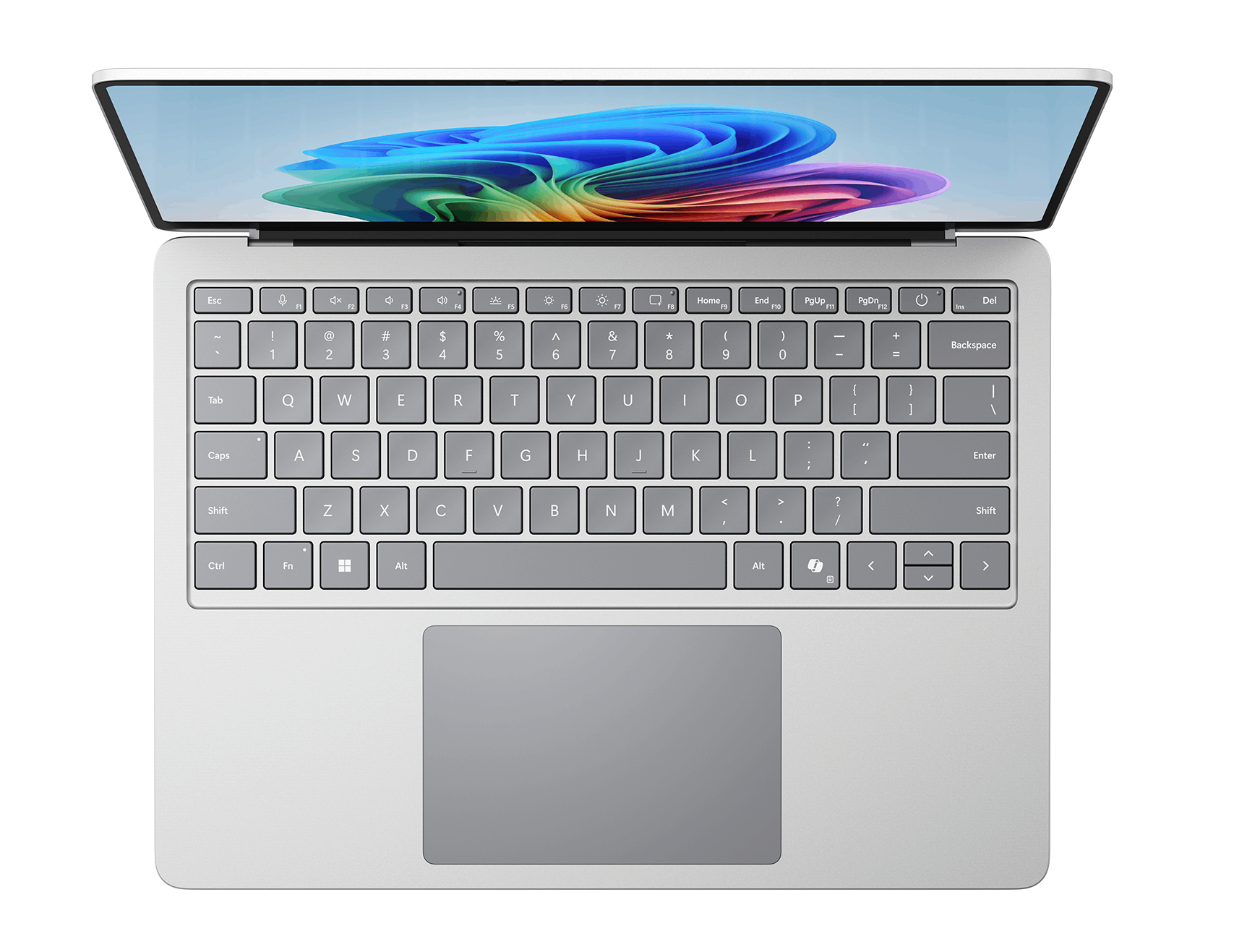 Un portátil abierto con teclado plateado y fondo de pantalla colorido.