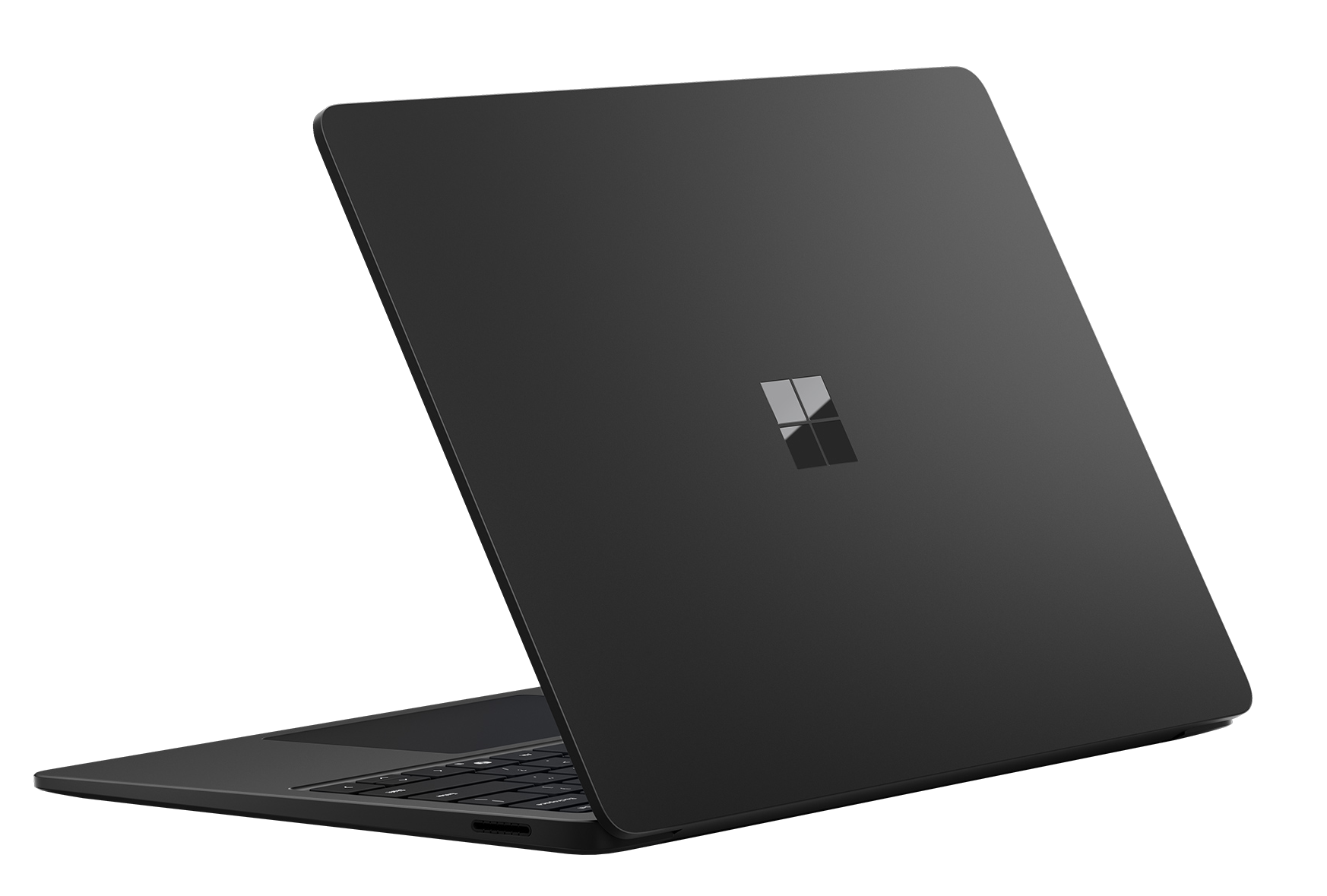 Portátil negro con logo de Microsoft, parcialmente abierto, mostrando teclado.