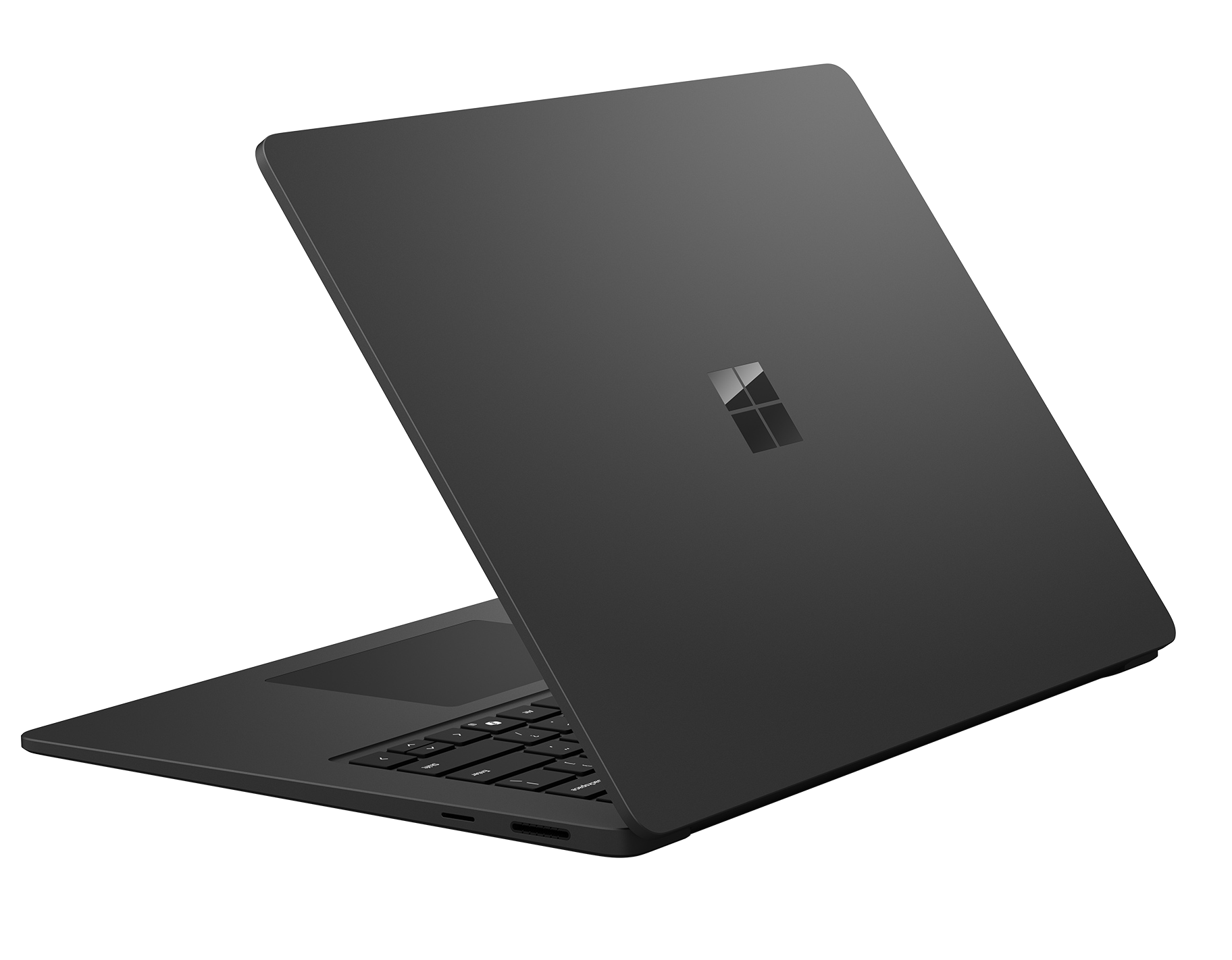 Un portátil oscuro y cerrado con el logo de Microsoft en la tapa.