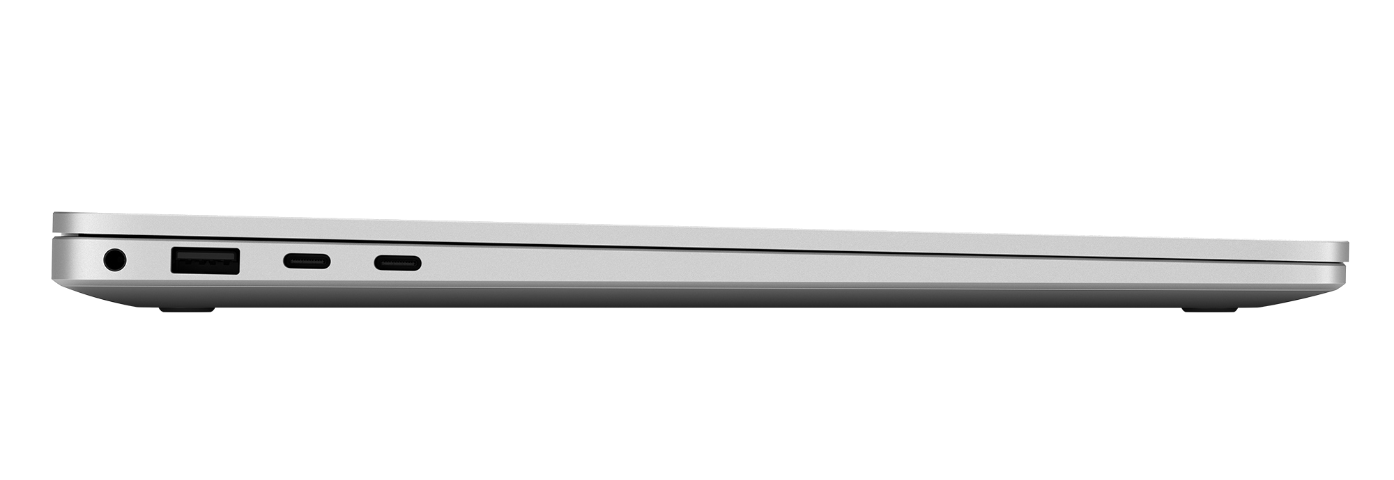 Perfil de portátil plateado con puertos: jack de auriculares, USB-A, dos USB-C.