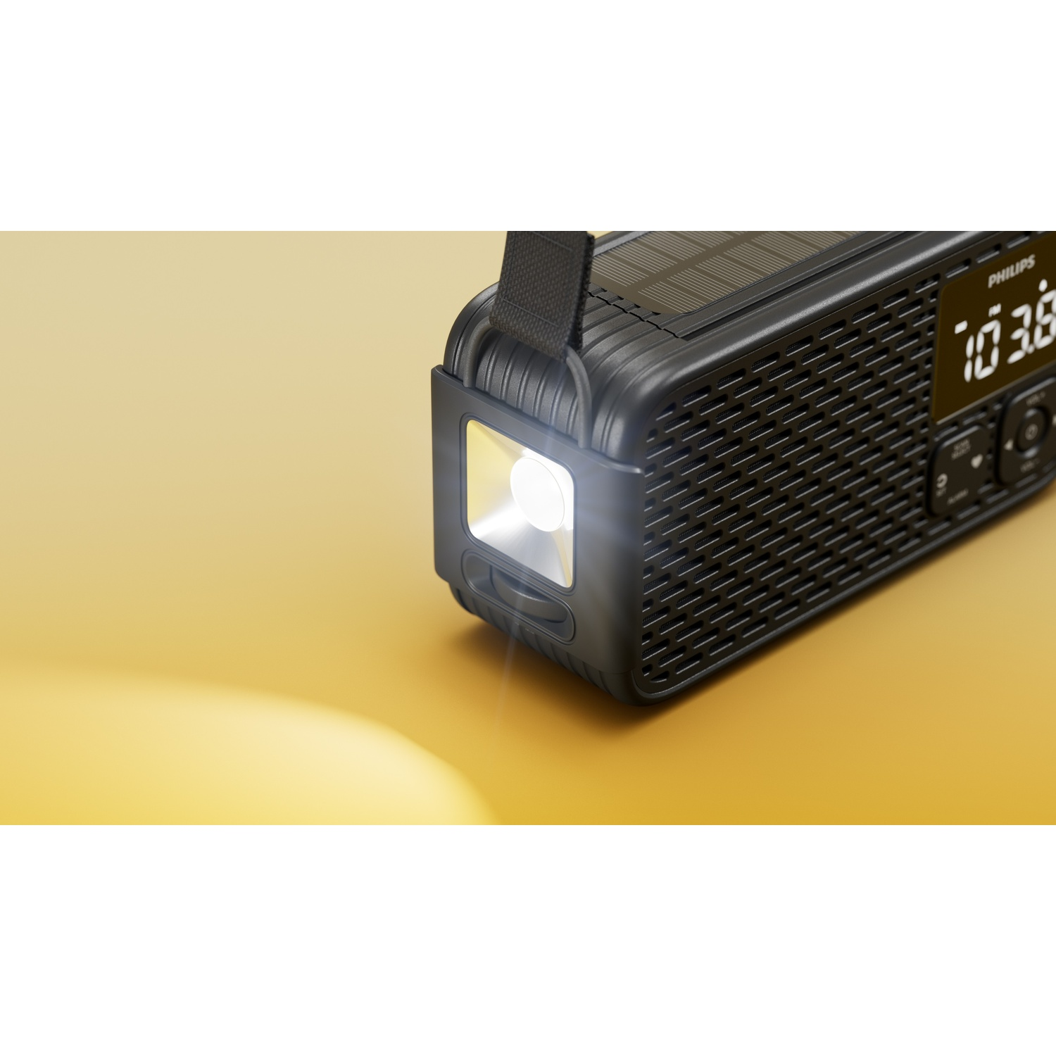 Una radio Philips nera con pannello solare, torcia illuminata e display.
