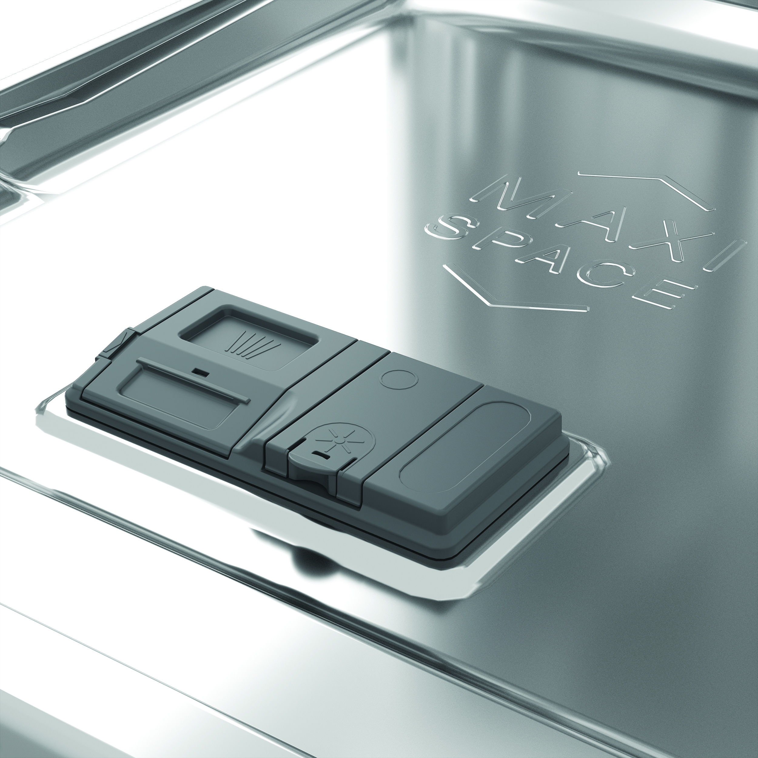 Dispensador de detergente gris sobre base metálica brillante con relieve.