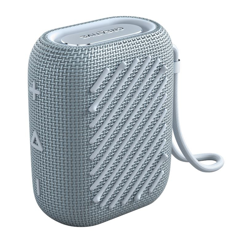 Mały, szary głośnik Bluetooth z tkaniny, z prążkowaną fakturą.