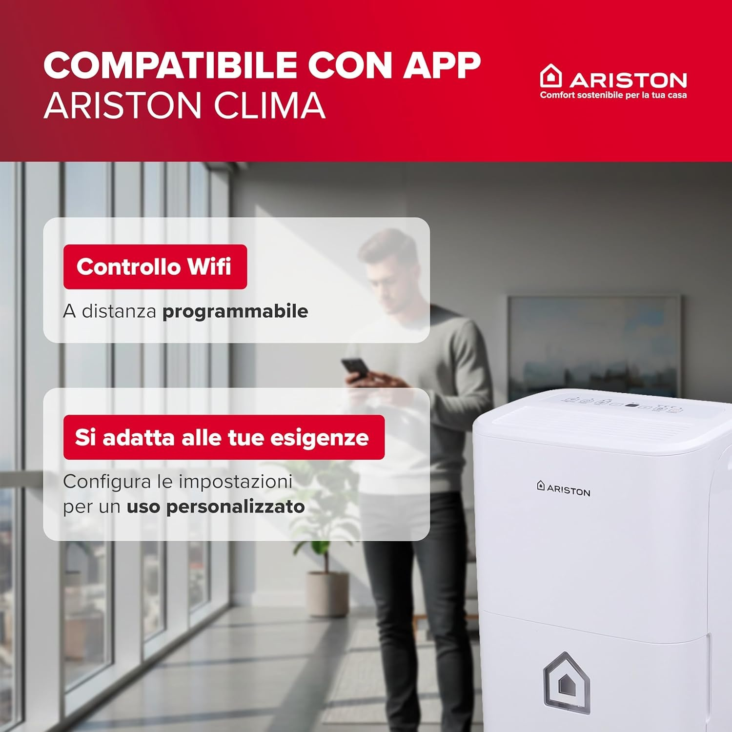 Un uomo usa il suo telefono accanto a un deumidificatore Ariston bianco.