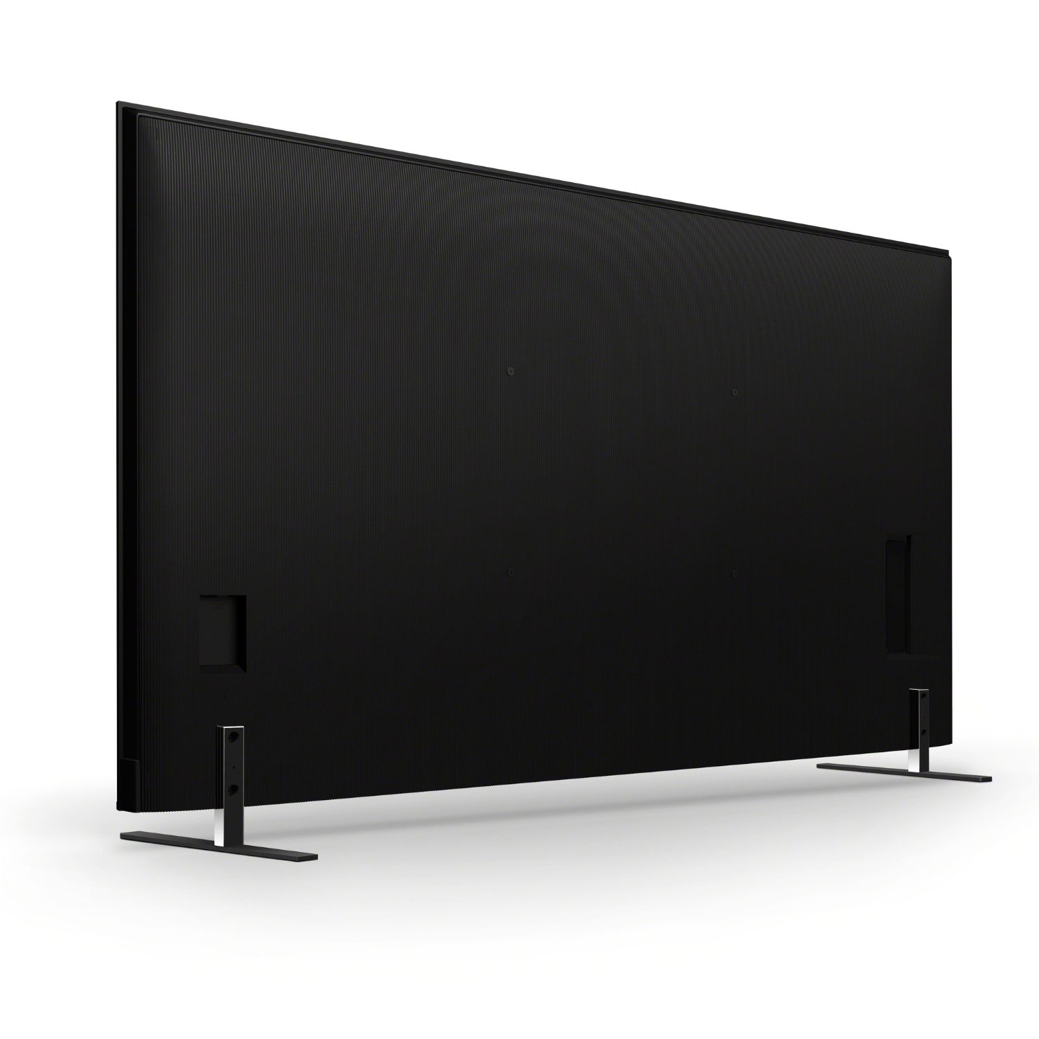 Parte trasera de un televisor negro de pantalla plana con bisel estrecho sobre dos soportes delgados.