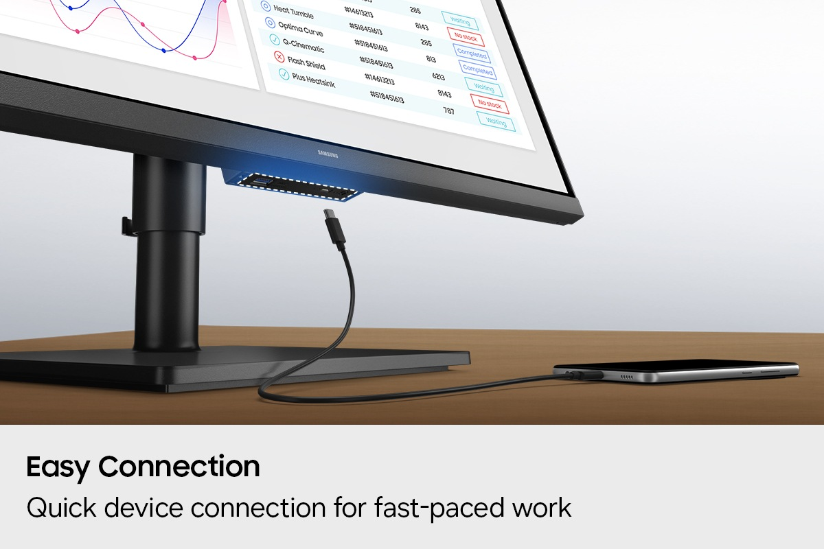 Un monitor mostra dati. Un cavo USB-C collega un telefono al monitor.
