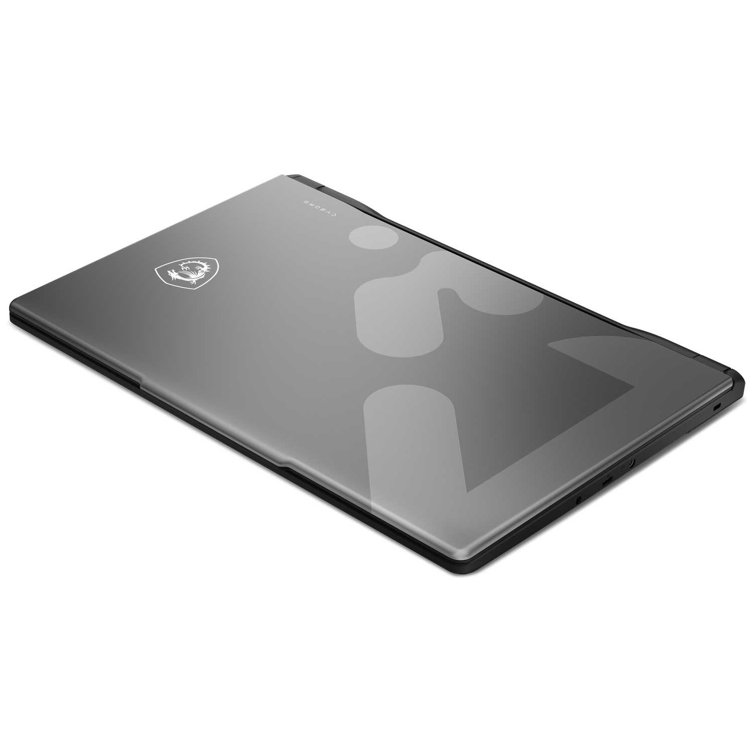 Un ordinateur portable gris fermé avec logo MSI et motif.