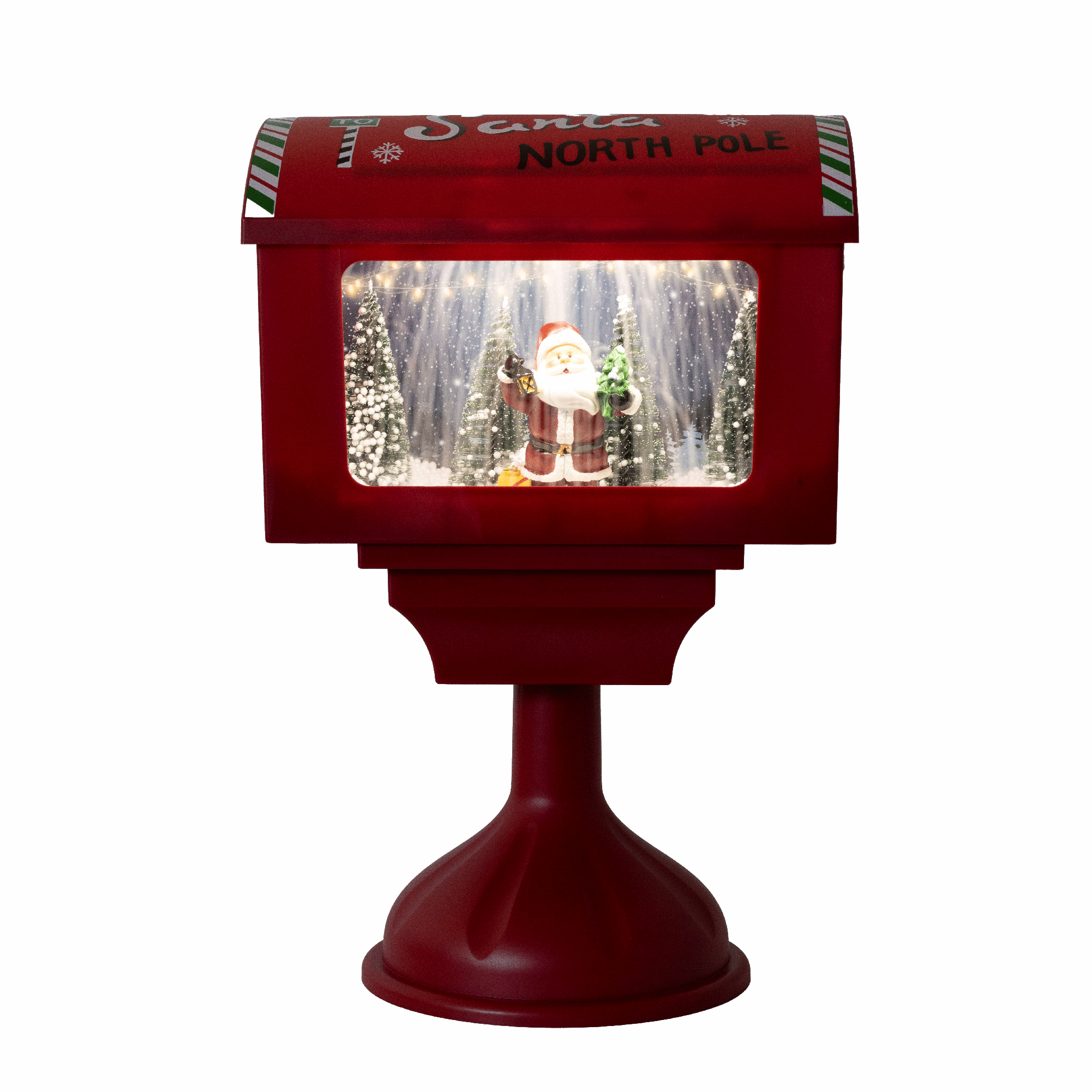Piros "Santa North Pole" feliratú postaláda, télapót, fákat és fényeket ábrázoló jelenettel.