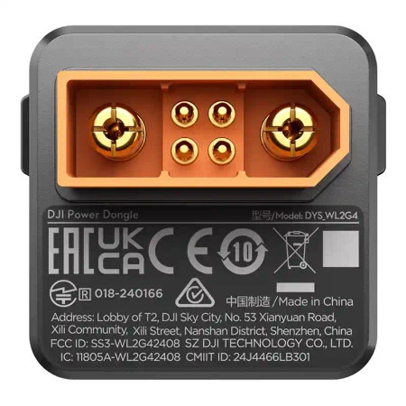 Szary DJI Power Dongle z pomarańczowym złączem i etykietami certyfikacyjnymi.
