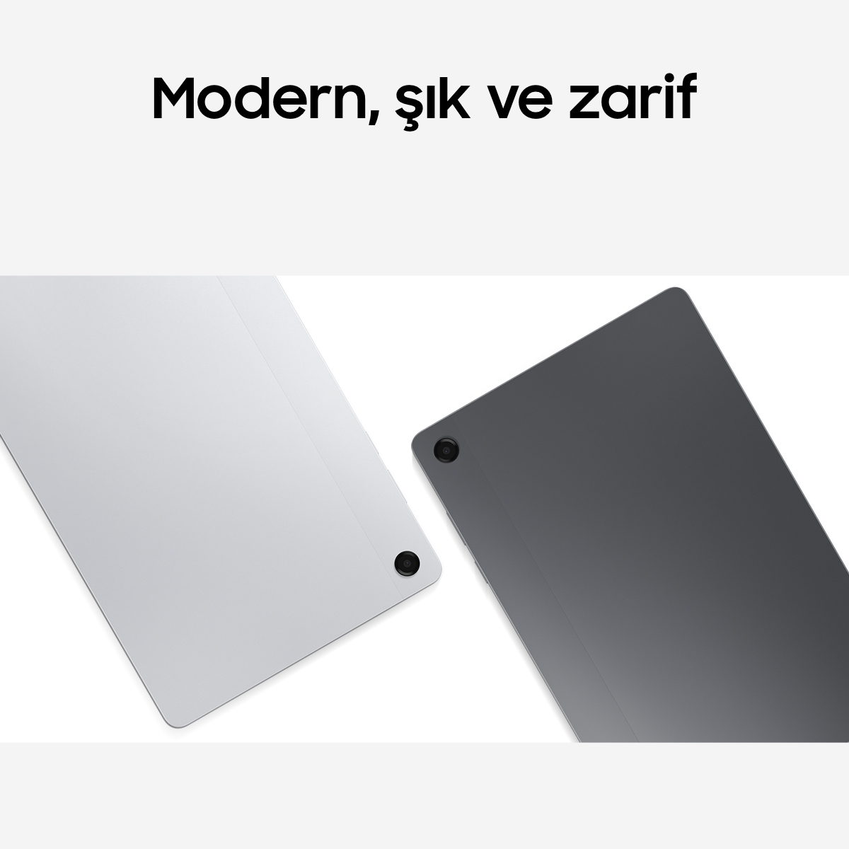 İki tablet, biri gümüş, biri antrasit, kameralı.