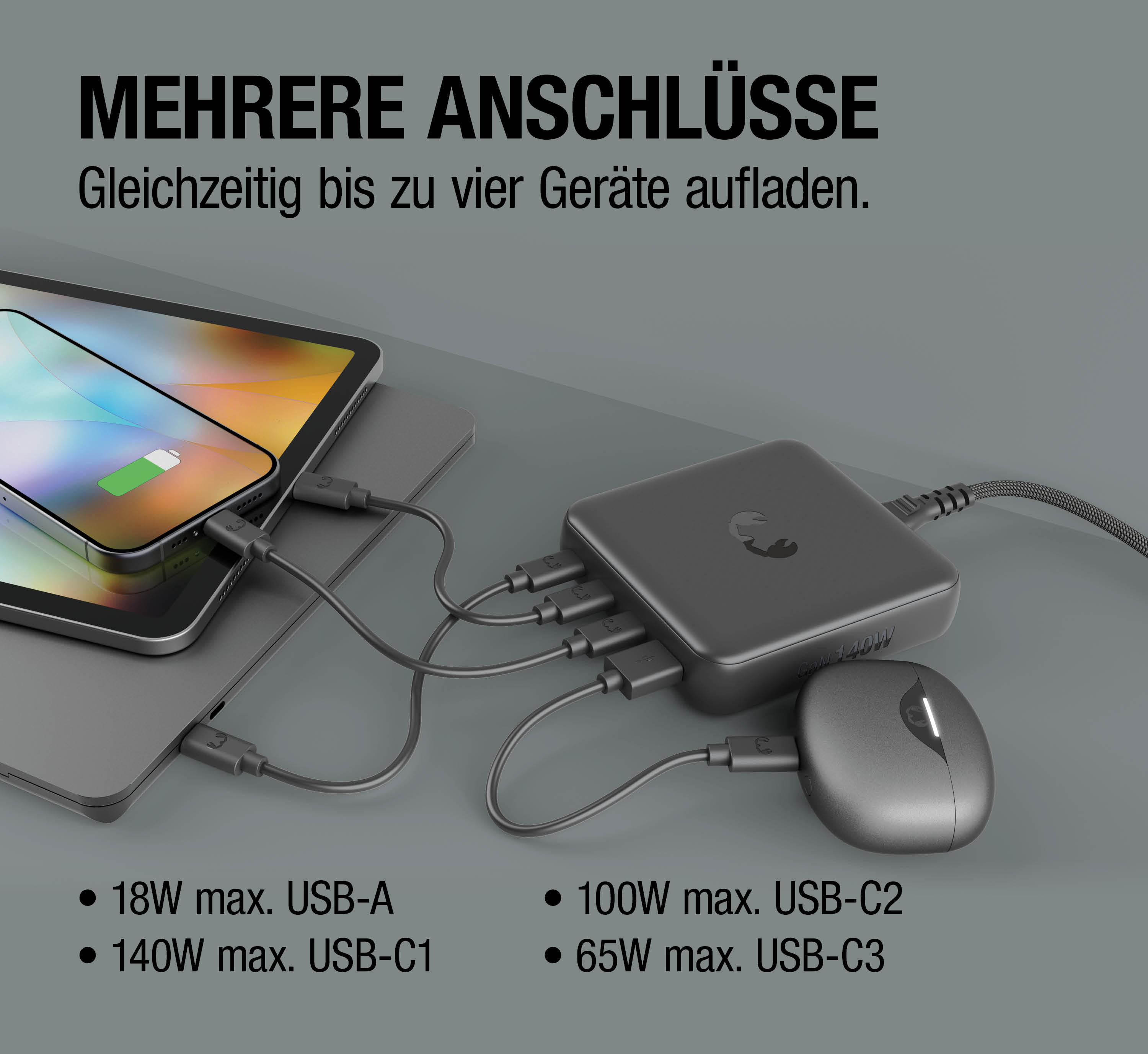 Ein dunkelgraues Ladegerät mit mehreren Anschlüssen, verbunden mit einem Handy, Tablet und Maus.