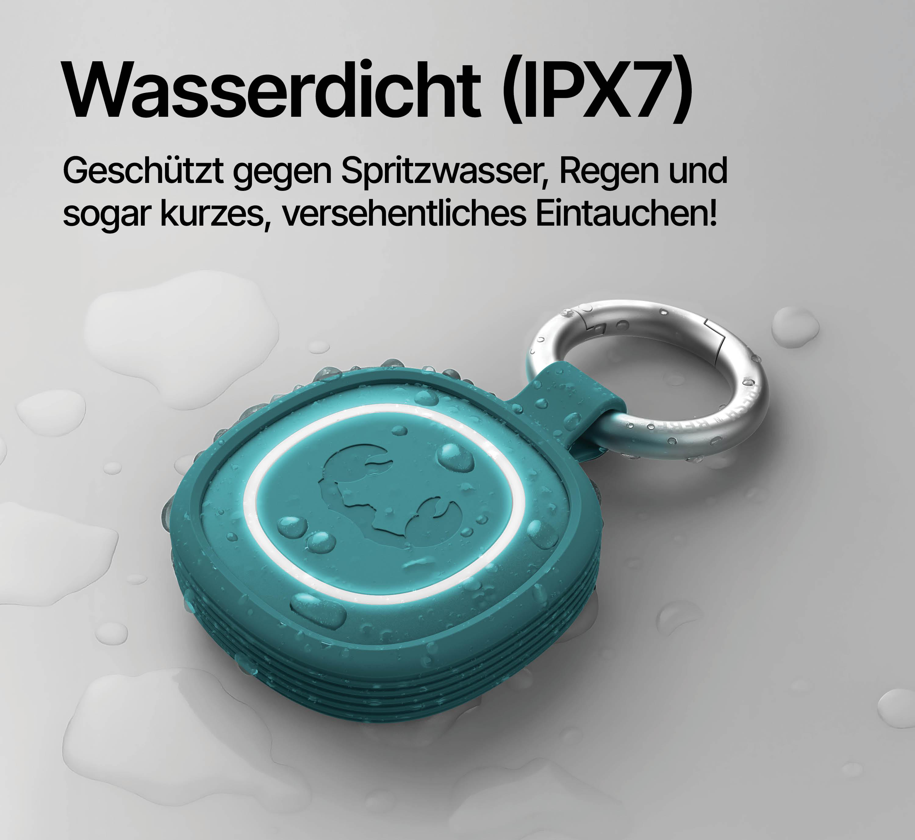 Ein türkisfarbener wasserdichter Lautsprecher mit einem silbernen Schlüsselring auf grauem Hintergrund.