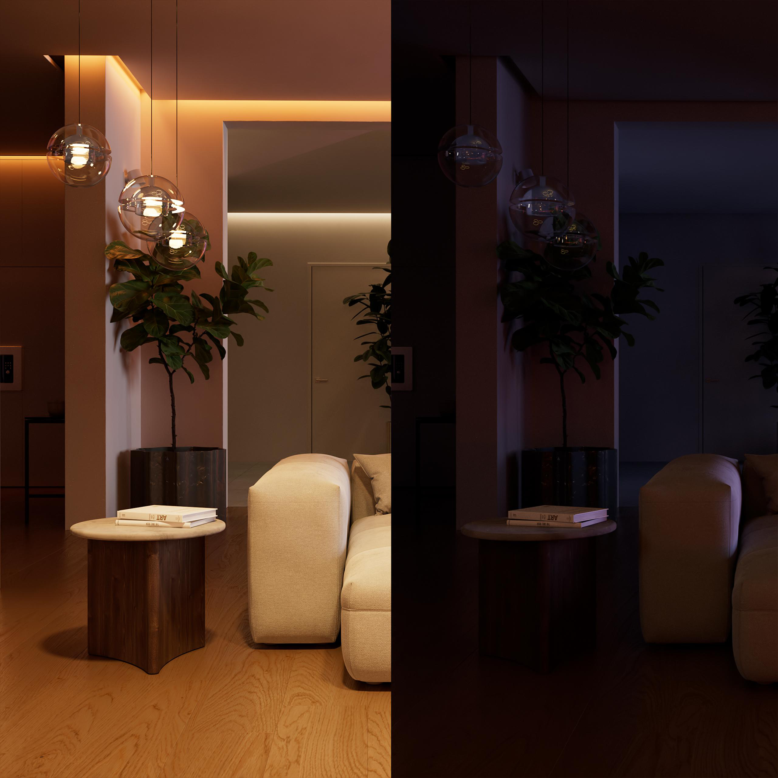 Ein Wohnzimmer mit Sofa, Couchtisch, Pflanzen und Deckenleuchten.