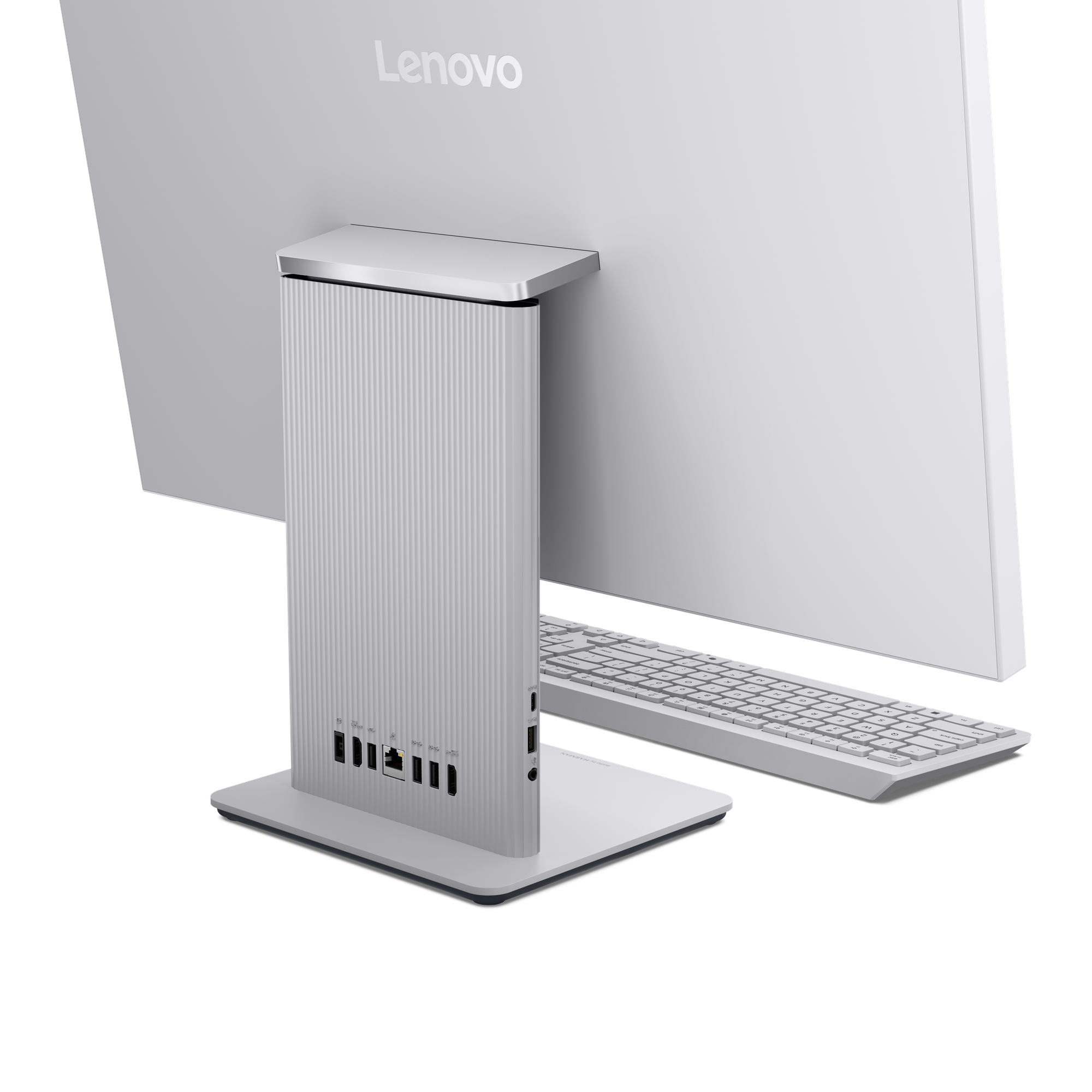 Achterkant van een witte Lenovo all-in-one computer, met poorten en toetsenbord.