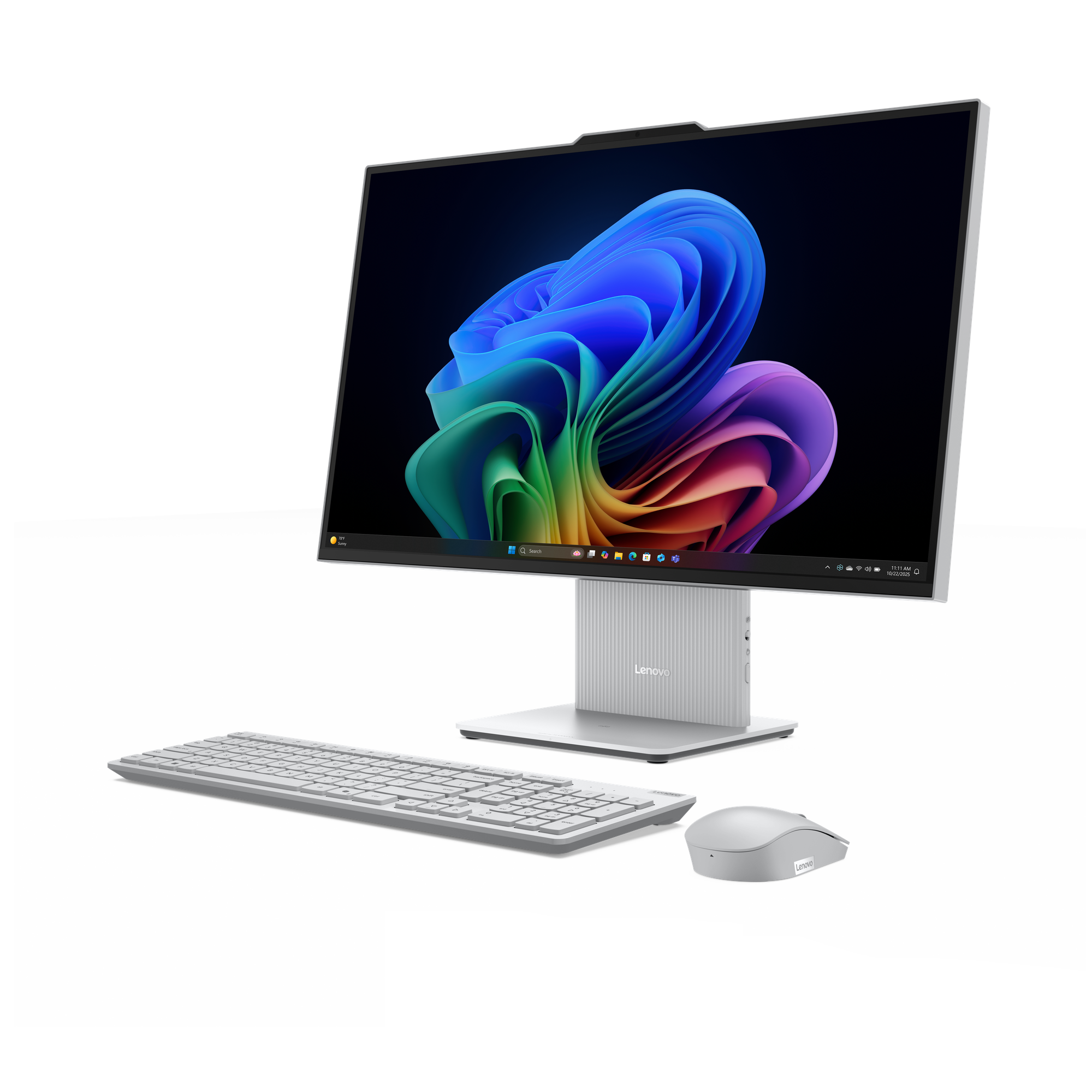 Een zilveren all-in-one computer met toetsenbord en muis tegen een zwarte achtergrond.