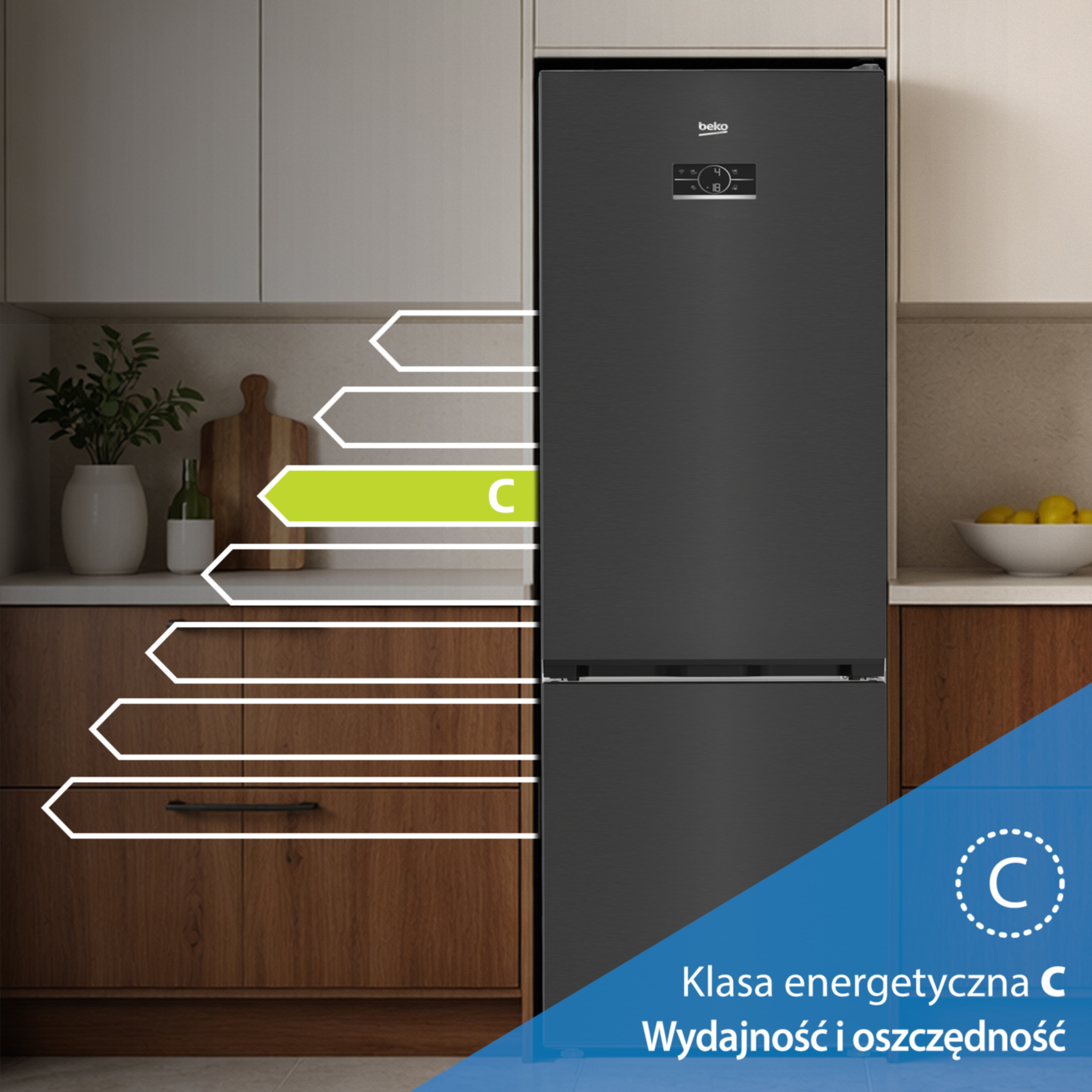 Czarna lodówka o klasie energetycznej C, obok szafek kuchennych.