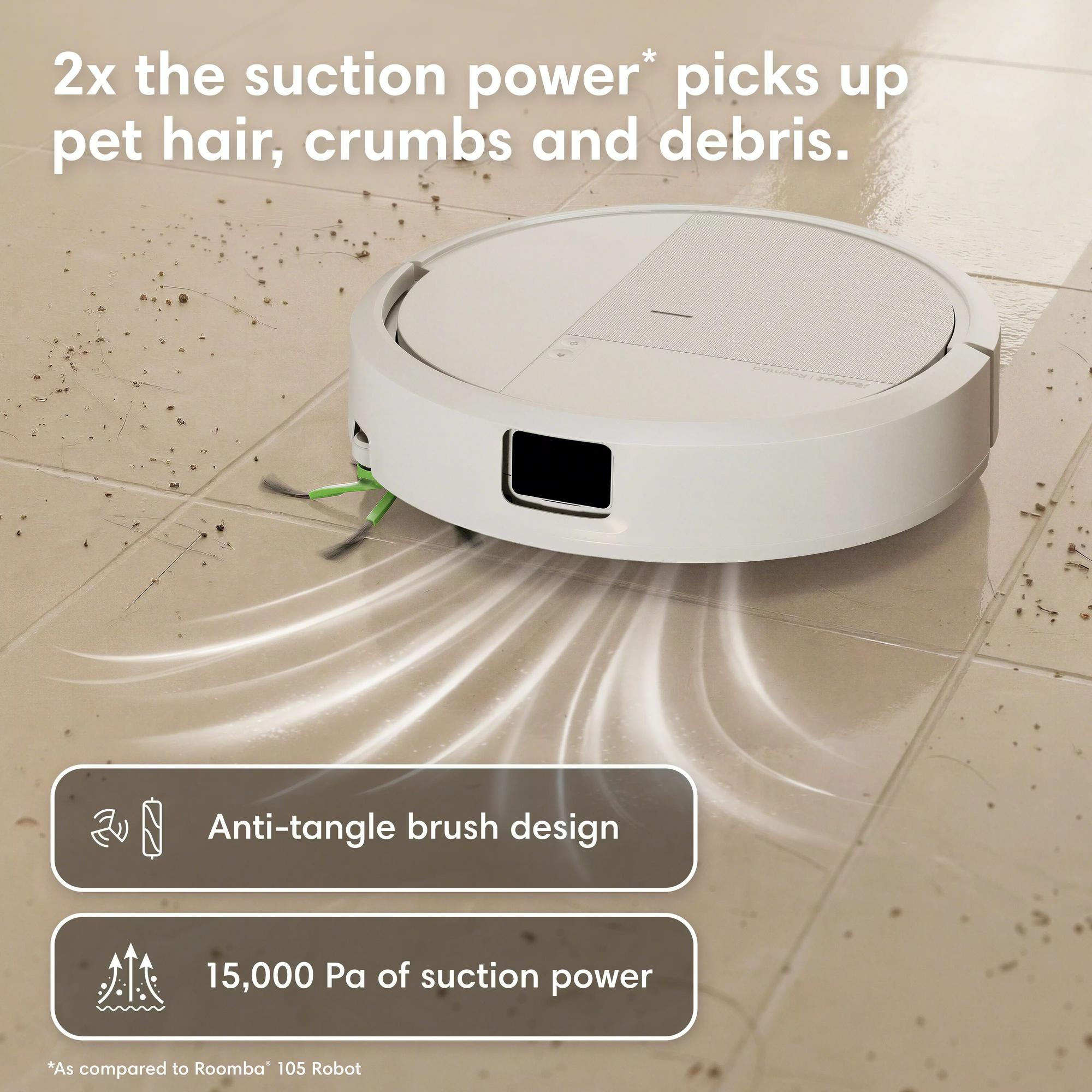 Un aspirateur robot blanc nettoie un sol sale avec des miettes et des poils.