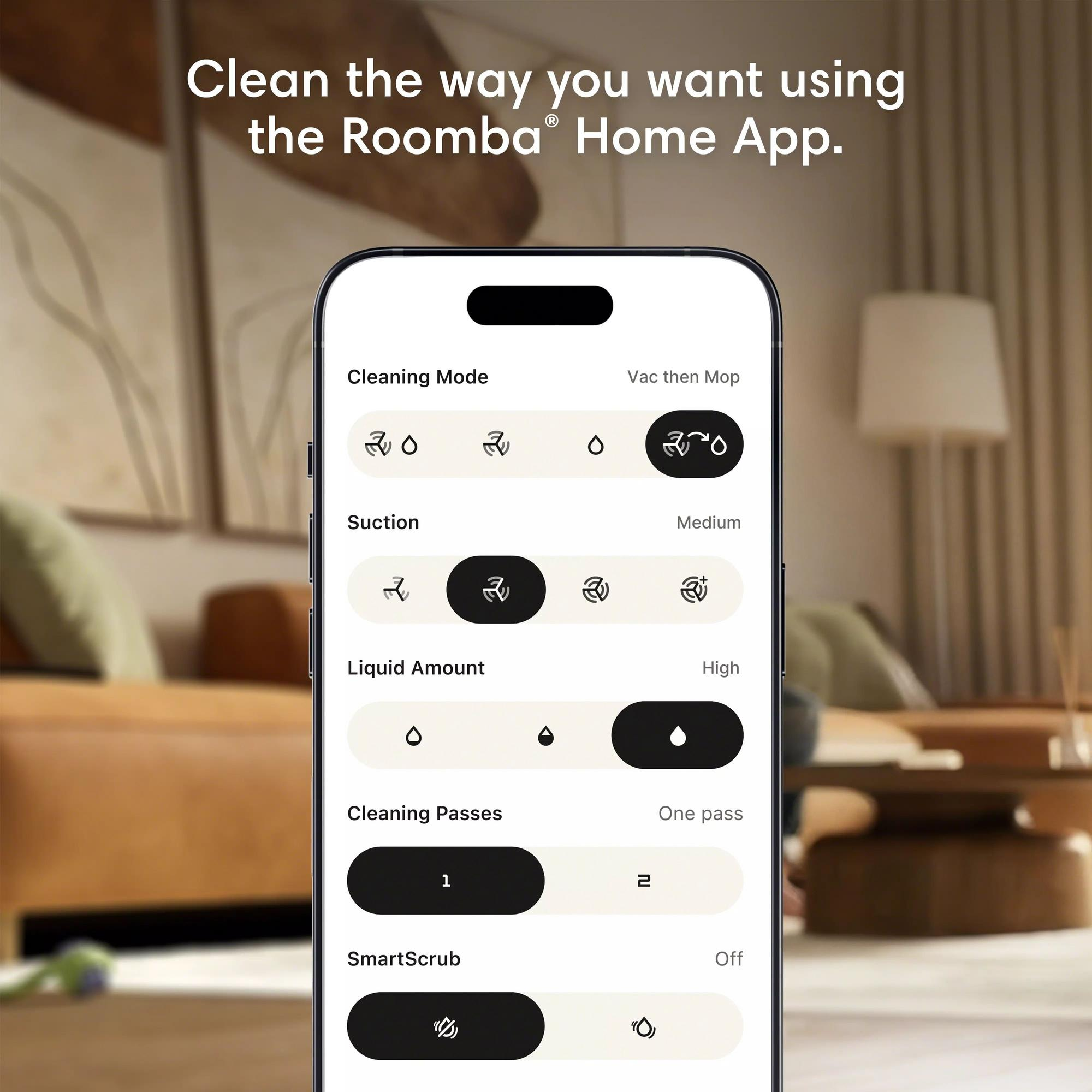 Un smartphone affiche l'application Roomba avec les paramètres du mode de nettoyage, de l'aspiration et de la quantité de liquide.