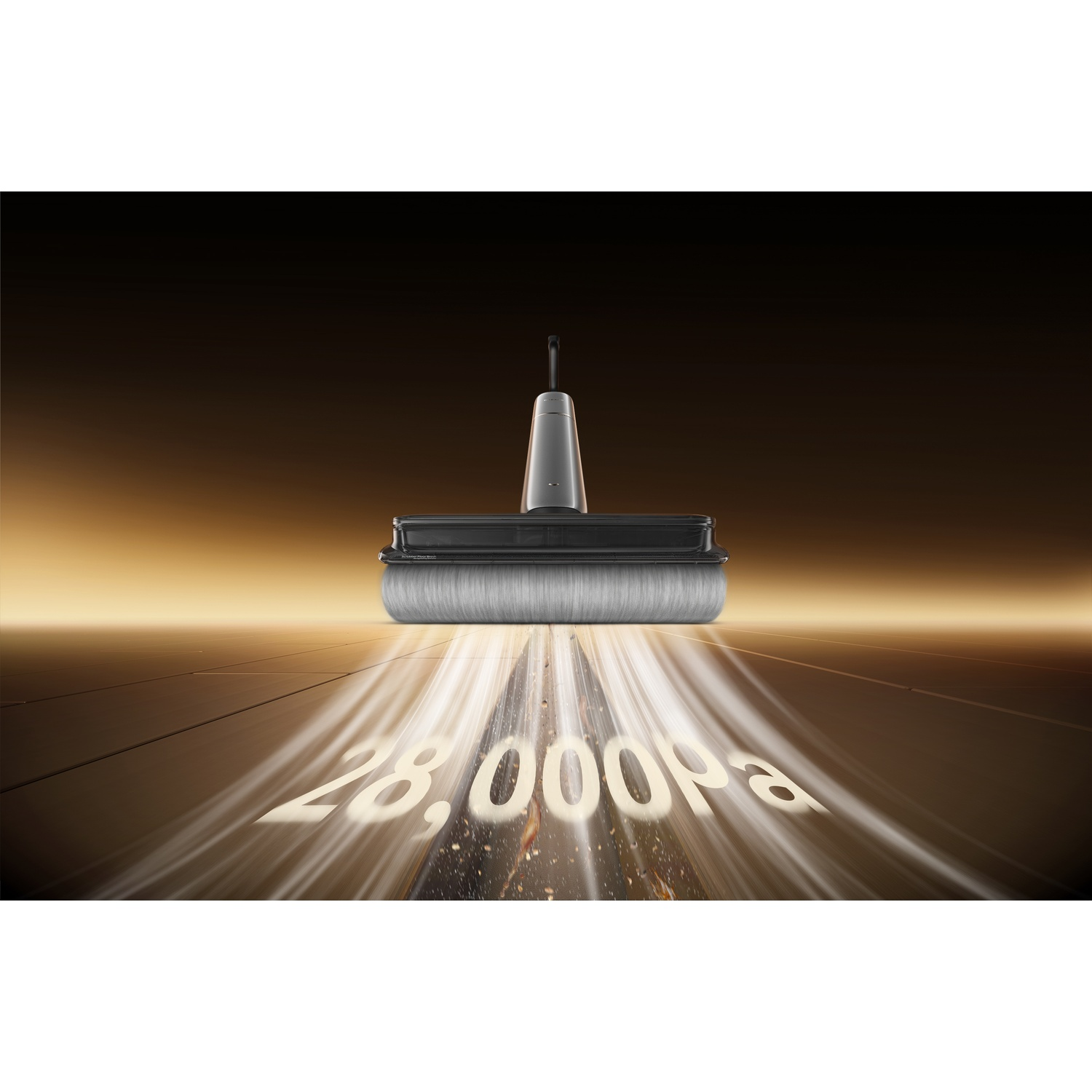Vacuum cleaner brush head sucking up debris with 28,000 Pa on a shiny floor.