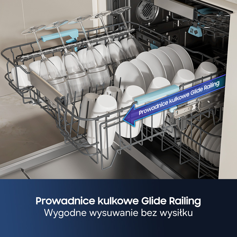 Kosz z naczyniami w zmywarce: kieliszki, kubki, talerze, prowadnice.