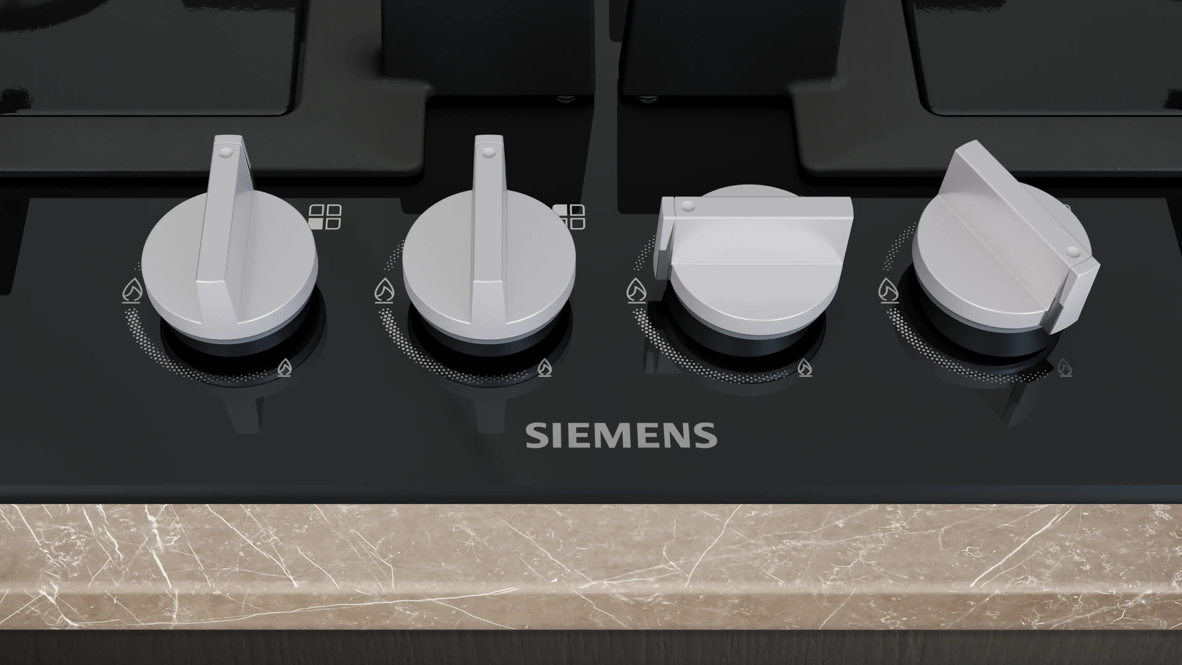 Cztery srebrne pokrętła na czarnej płycie grzewczej z logo Siemens.