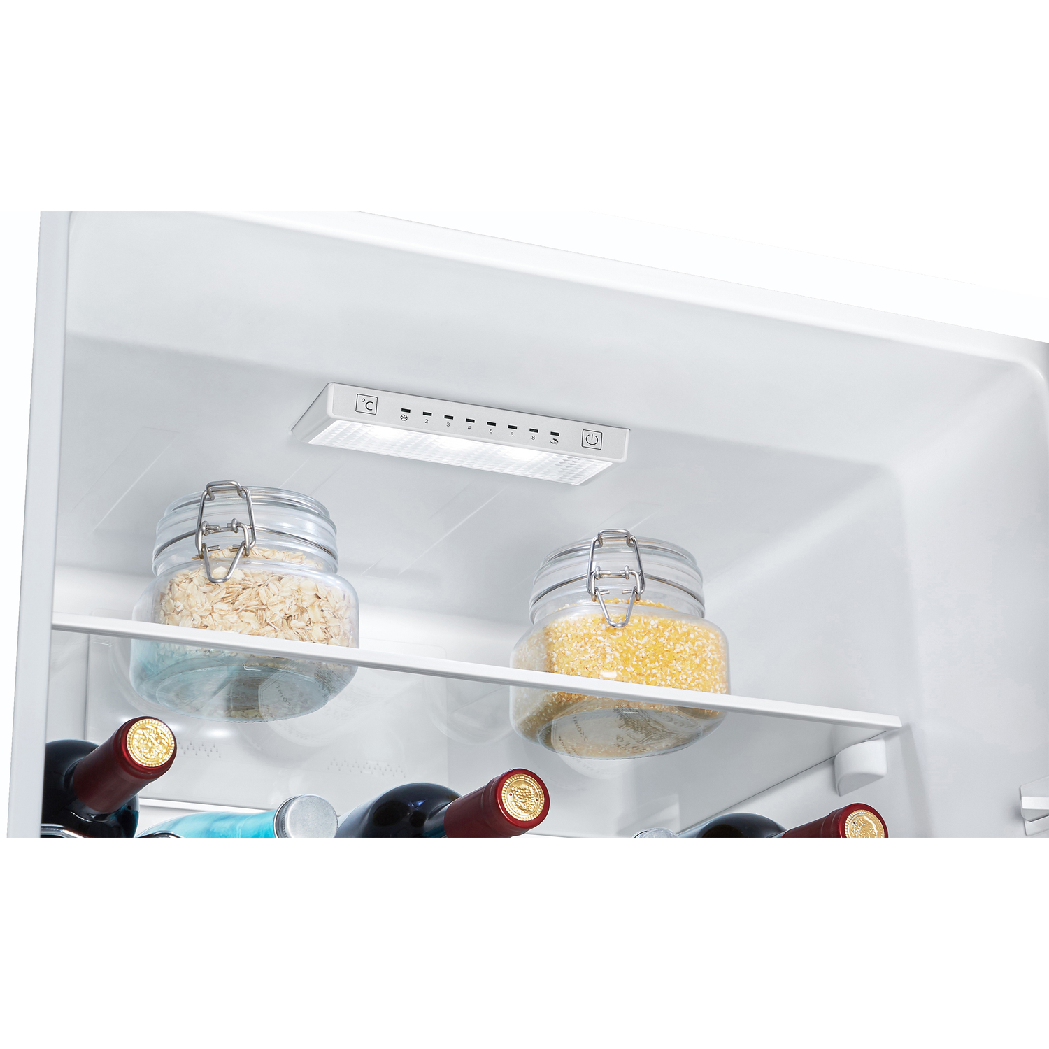 Interior of a refrigerator with jars and wine bottles on shelves.
