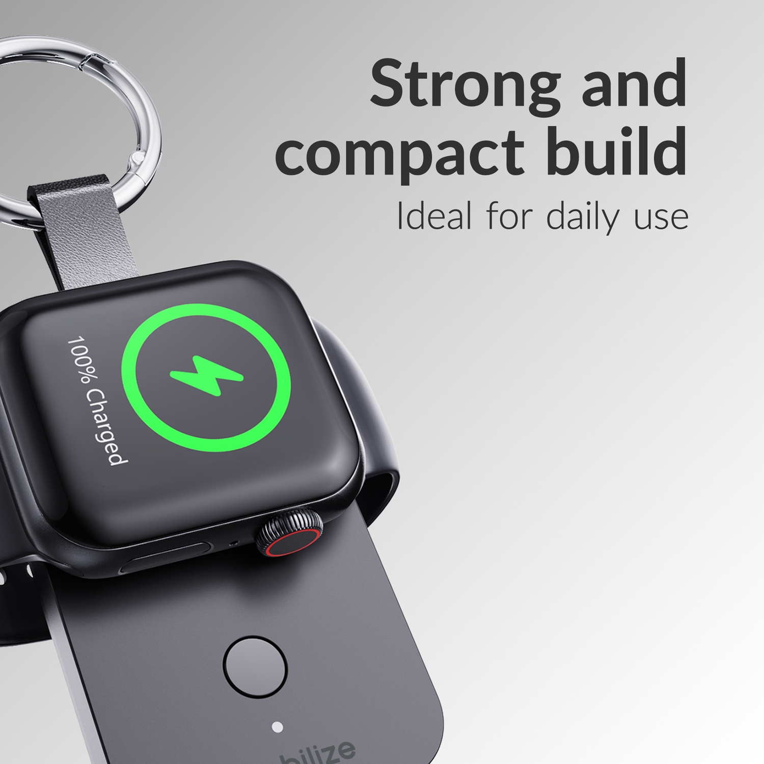 Montre connectée noire en charge sur adaptateur, affichage 100% chargé.