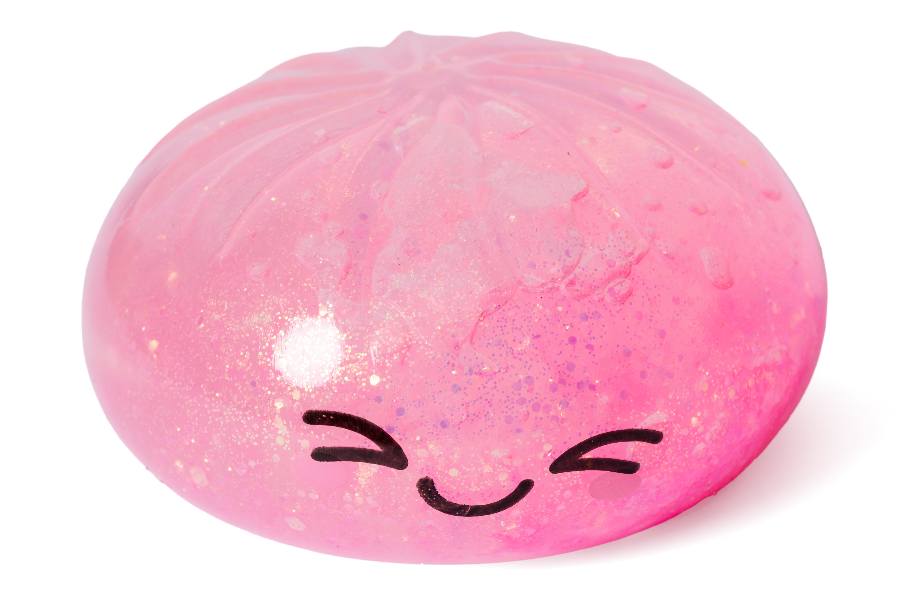 Eine glitzernde rosa Kugel mit einem lächelnden Gesicht und geschlossenen Augen.
