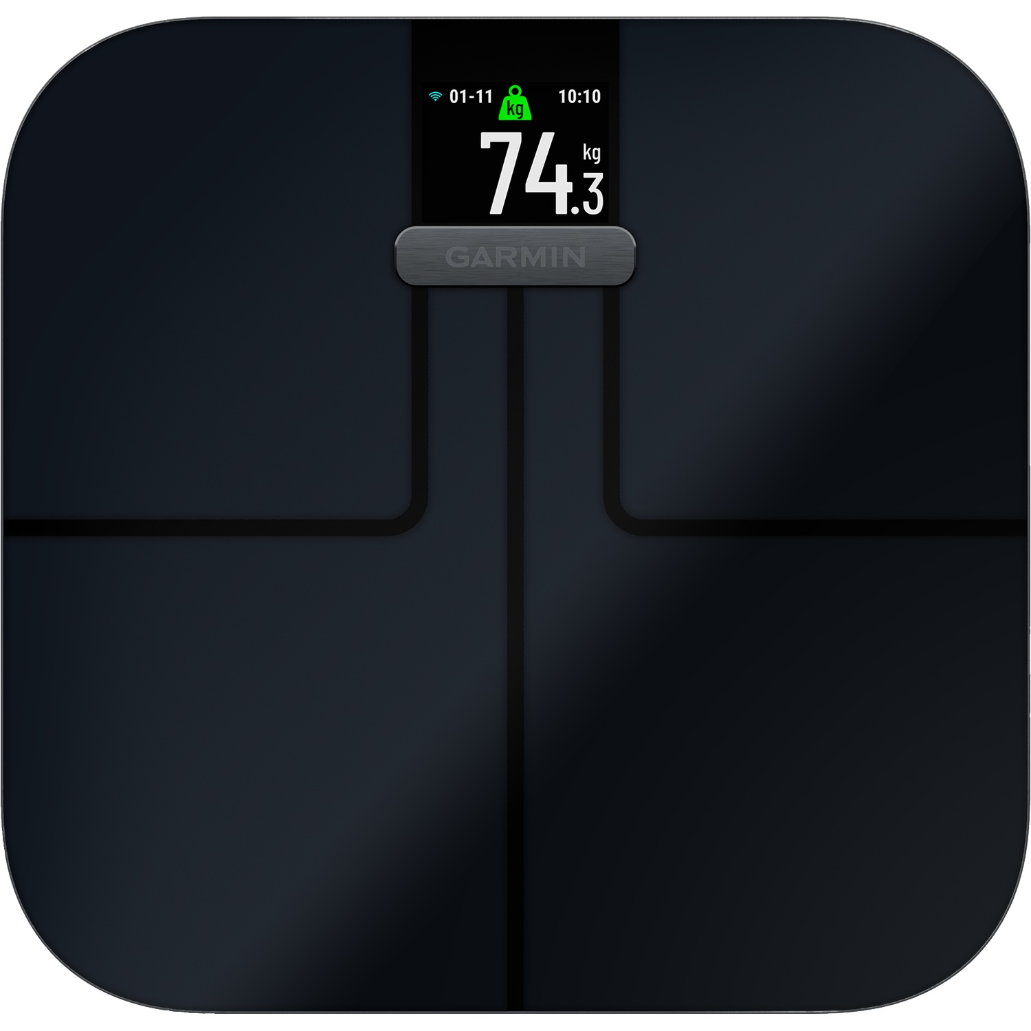 A black digital scale shows 74.3 kg on its illuminated screen.