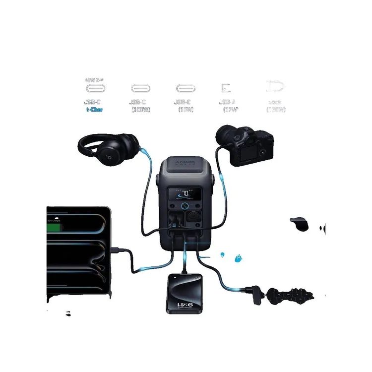 Una central eléctrica portátil carga un smartphone, auriculares y una cámara.
