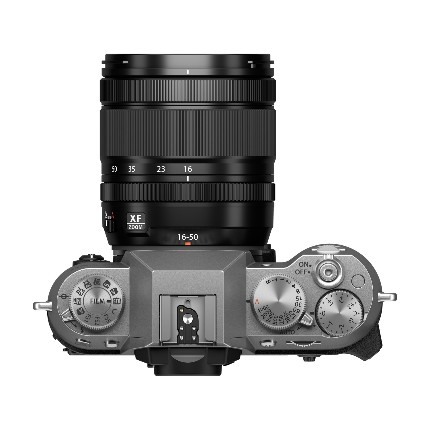 Una fotocamera argentata con obiettivo vista dall'alto. Con ghiere di messa a fuoco e zoom.