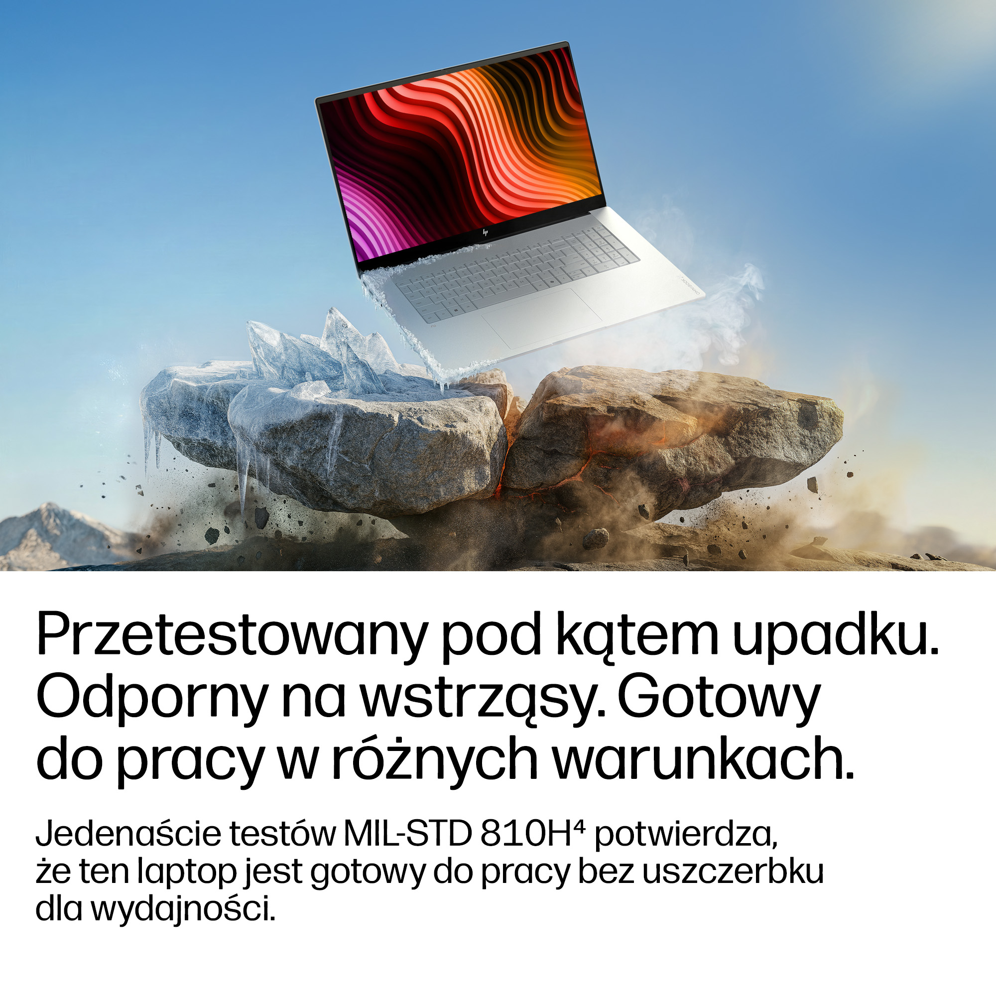 Laptop unosi się nad kamieniami z lodem i dymem, odporny na upadki i wstrząsy.