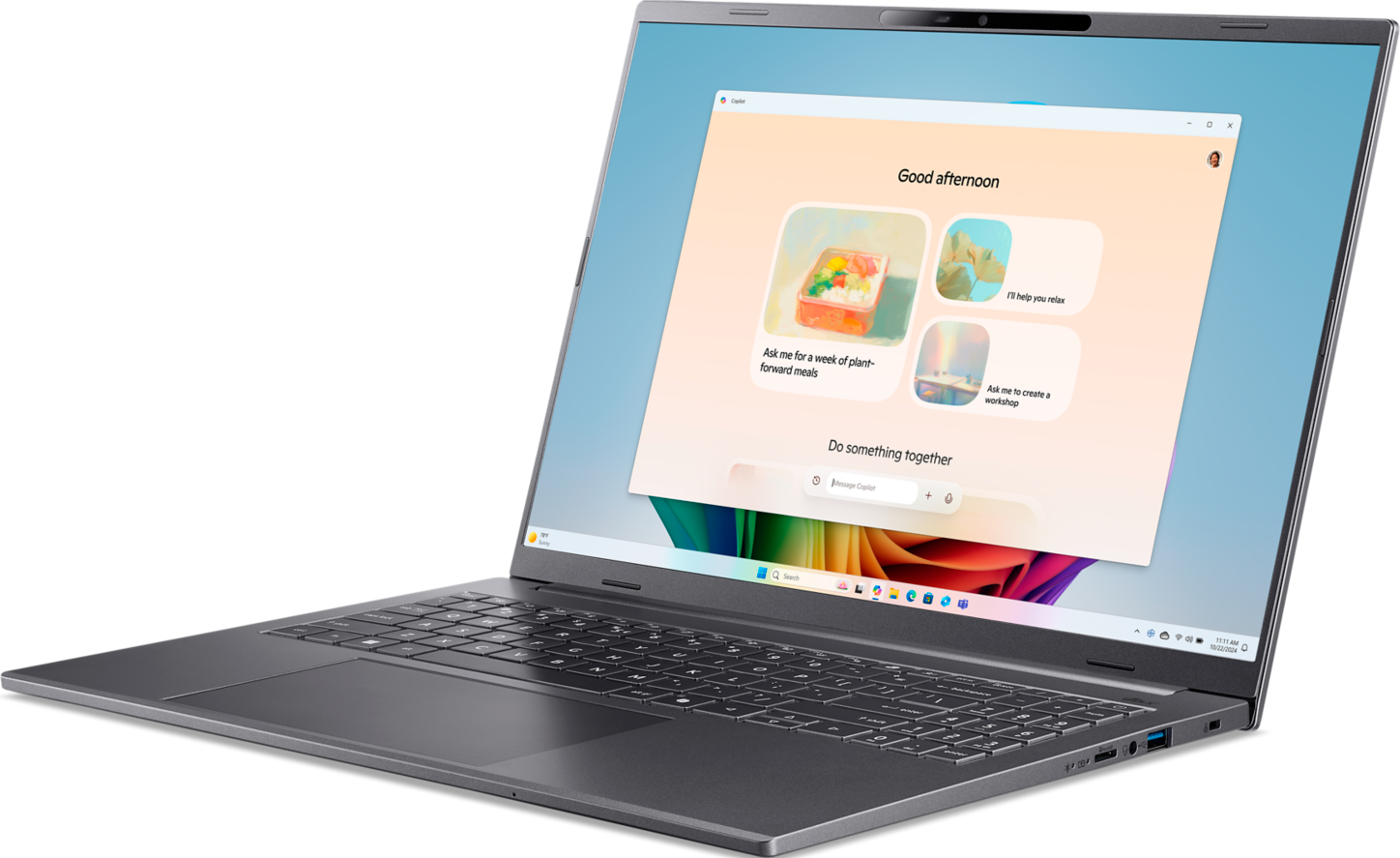 Grauer Laptop mit geöffnetem Copilot-Fenster, das Mahlzeiten vorschlägt.