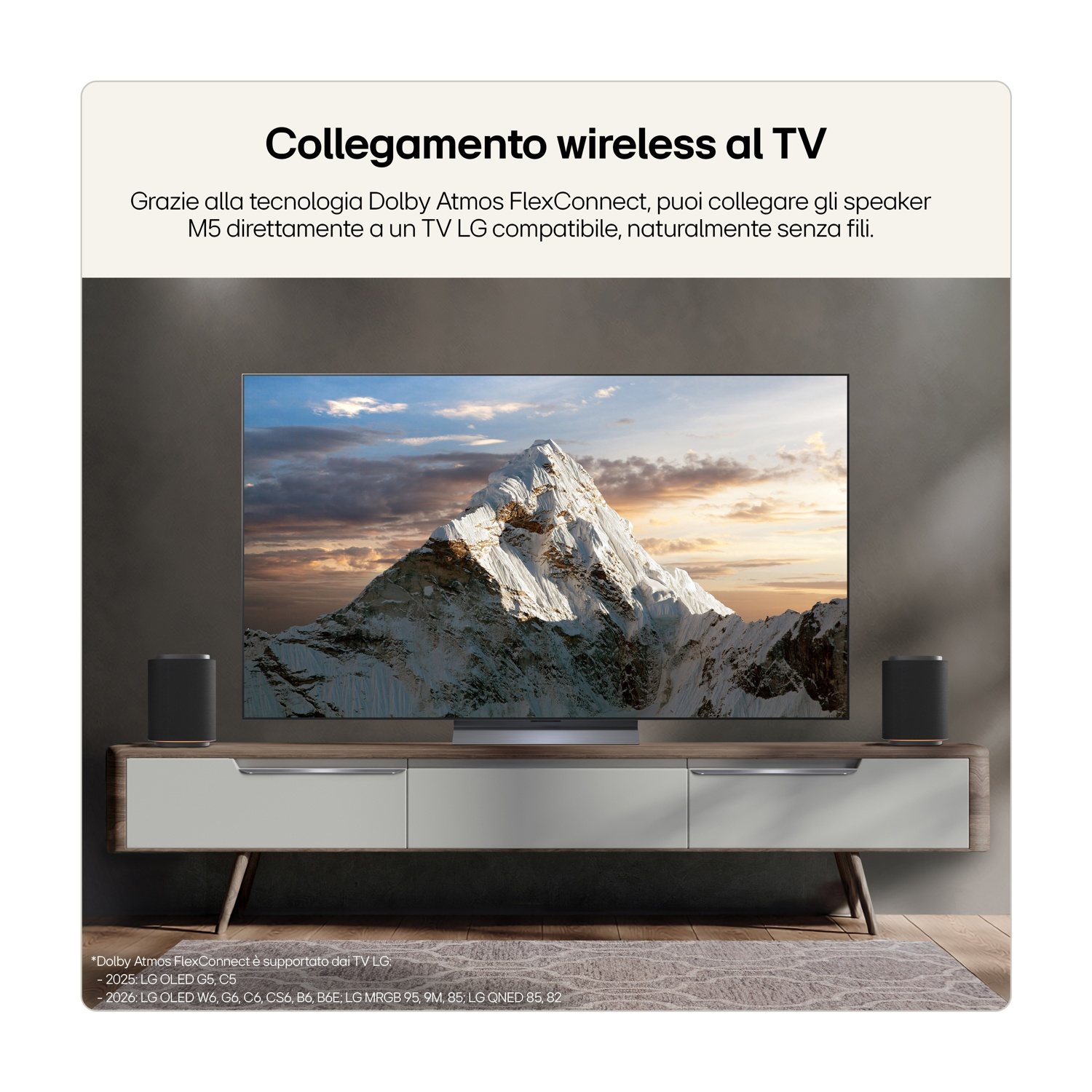 Un TV LG con due altoparlanti neri e un paesaggio di montagna.